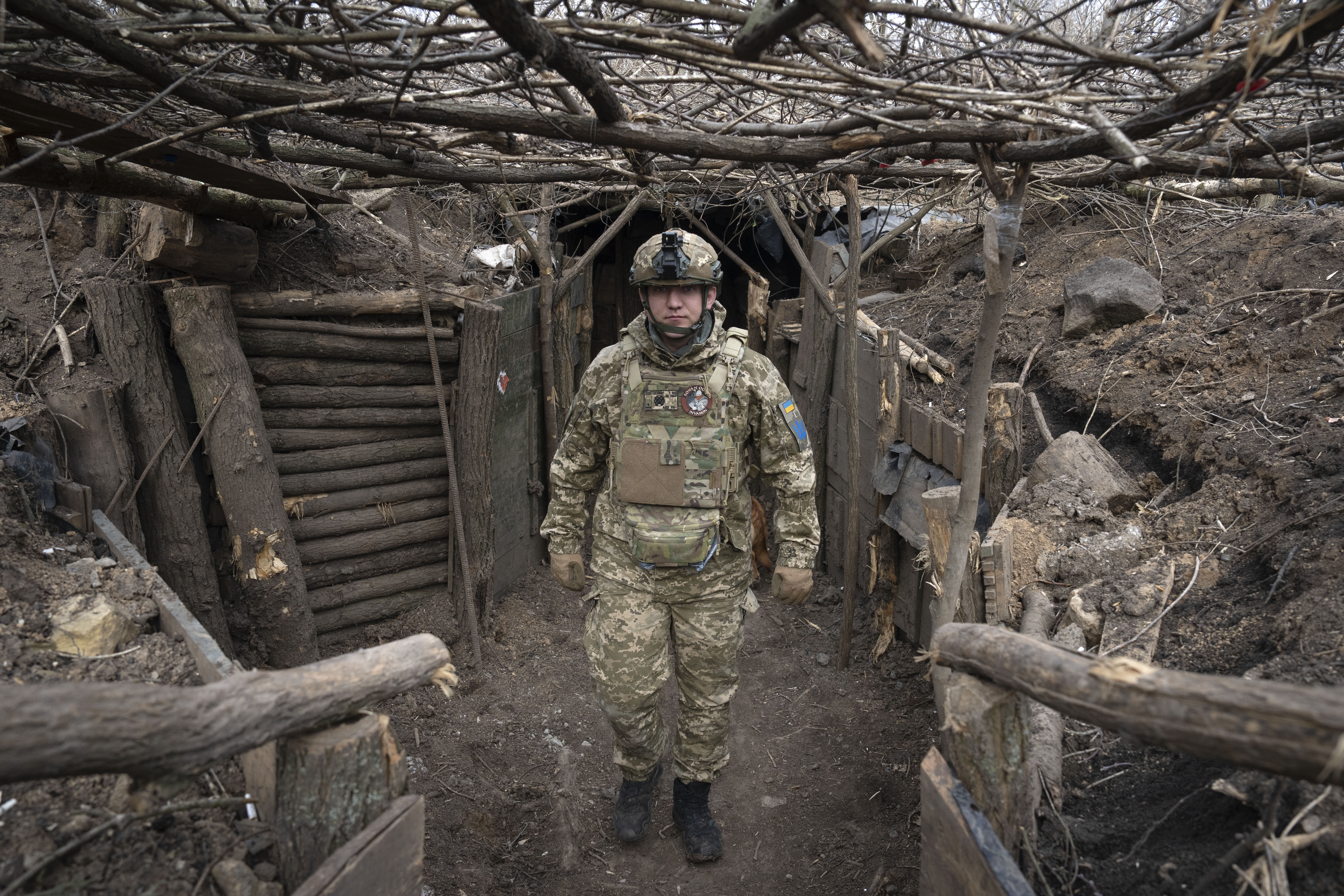 FILE - A Ukrainian serviceman of the 28th Separate Mechanised Brigade stands in a trench at the front line, near Bakhmut, Donetsk region, Ukraine, March 3, 2024. (AP Photo/Efrem Lukatsky, File)