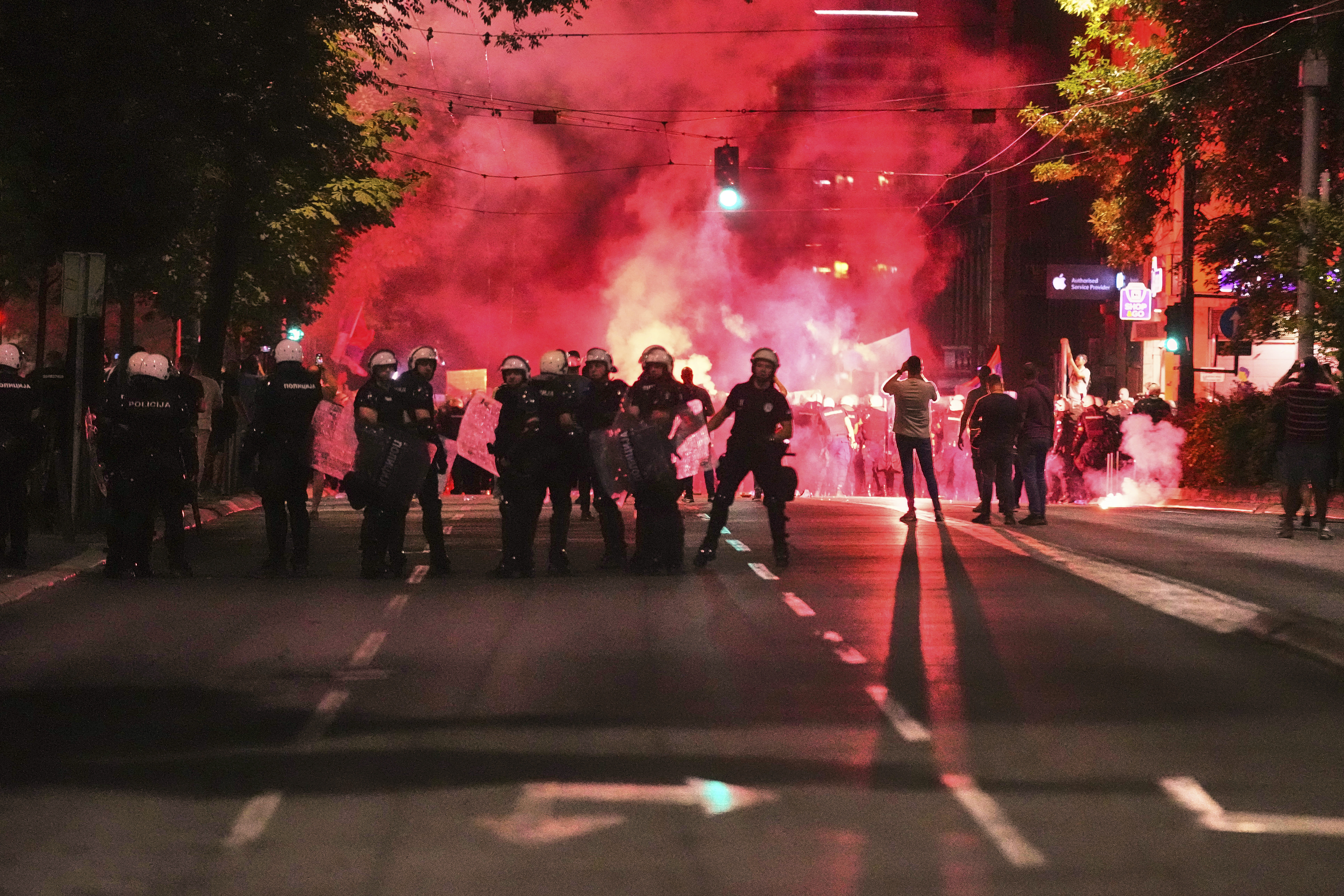 Anti-government protesters clash with riot police in Serbia