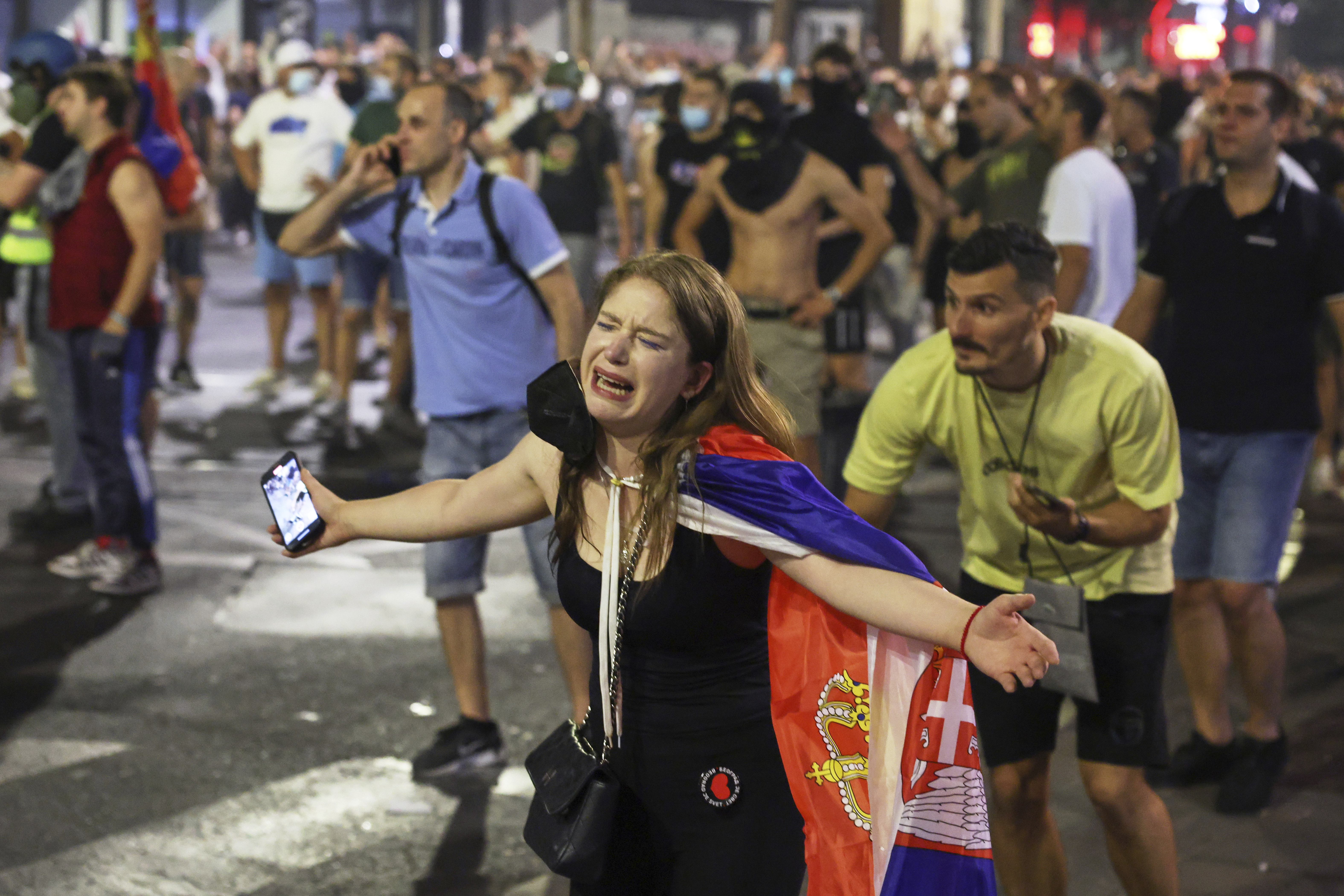 Anti-government protesters clash with riot police in Serbia