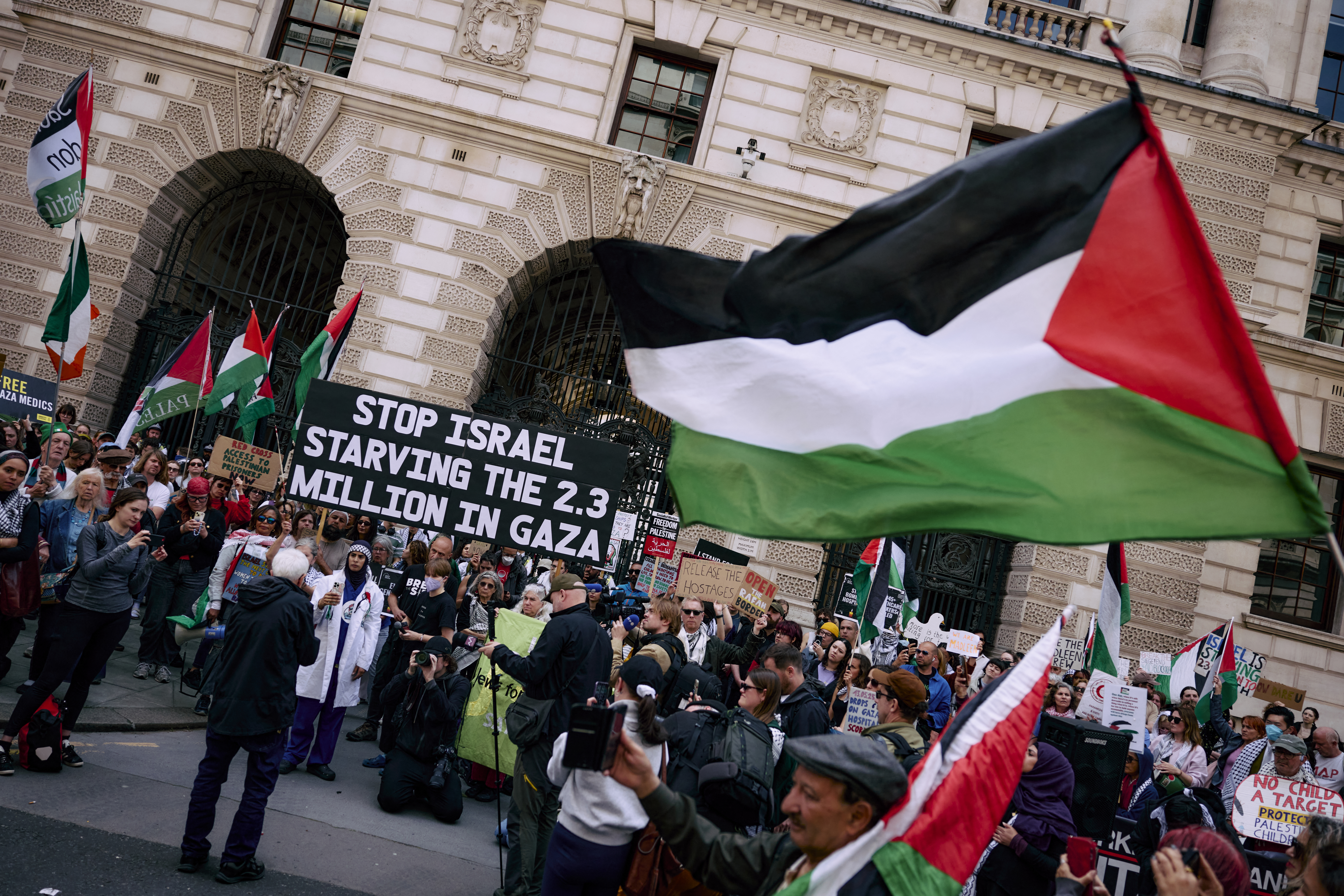 Demonstrators in London demand the UK government protect the crew of the Gaza Freedom Flotilla [Benjamin Cremel/AFP]