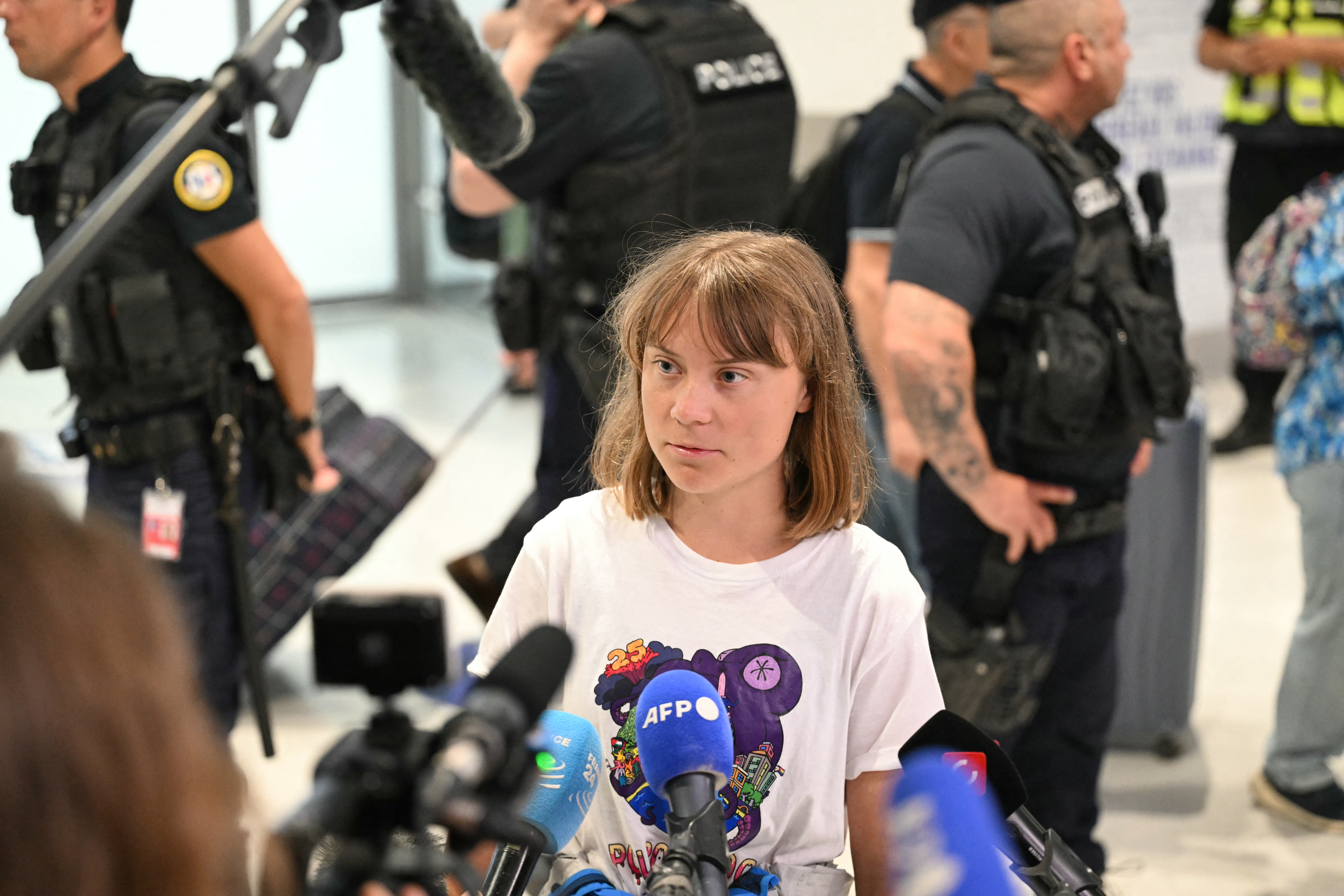 Swedish campaigner Greta Thunberg talks to journalists upon her arrival to Roissy-Charles de Gaulle Airport, as she left Israel on a flight to Sweden via France, after she was detained along with other activists aboard a Gaza-bound aid boat, on June 10, 2025.