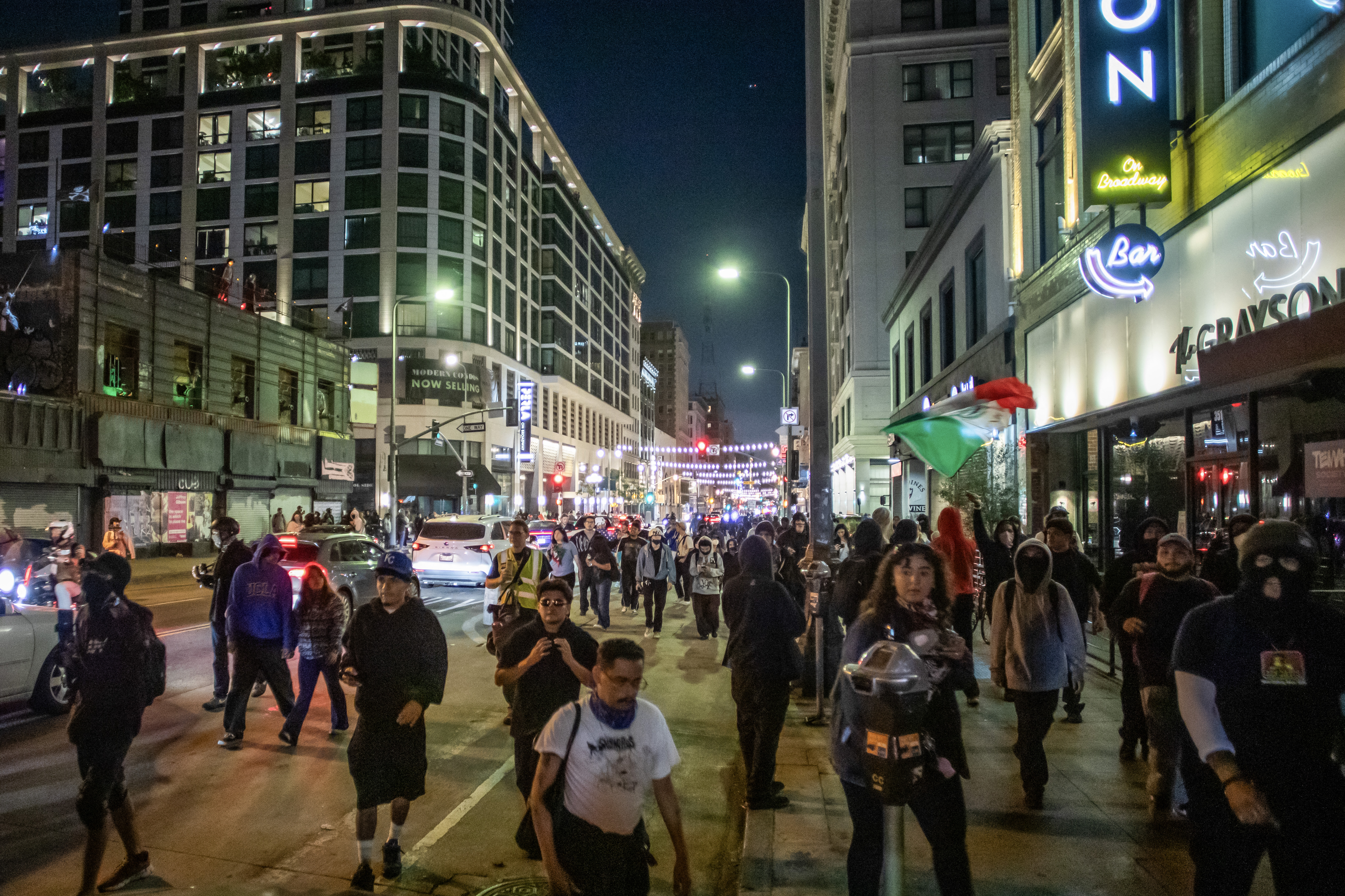 Demonstrators walk in groups in downtown despite a curfew that was put into effect following days of protests in response to federal immigration operations in Los Angeles on June 10, 2025.