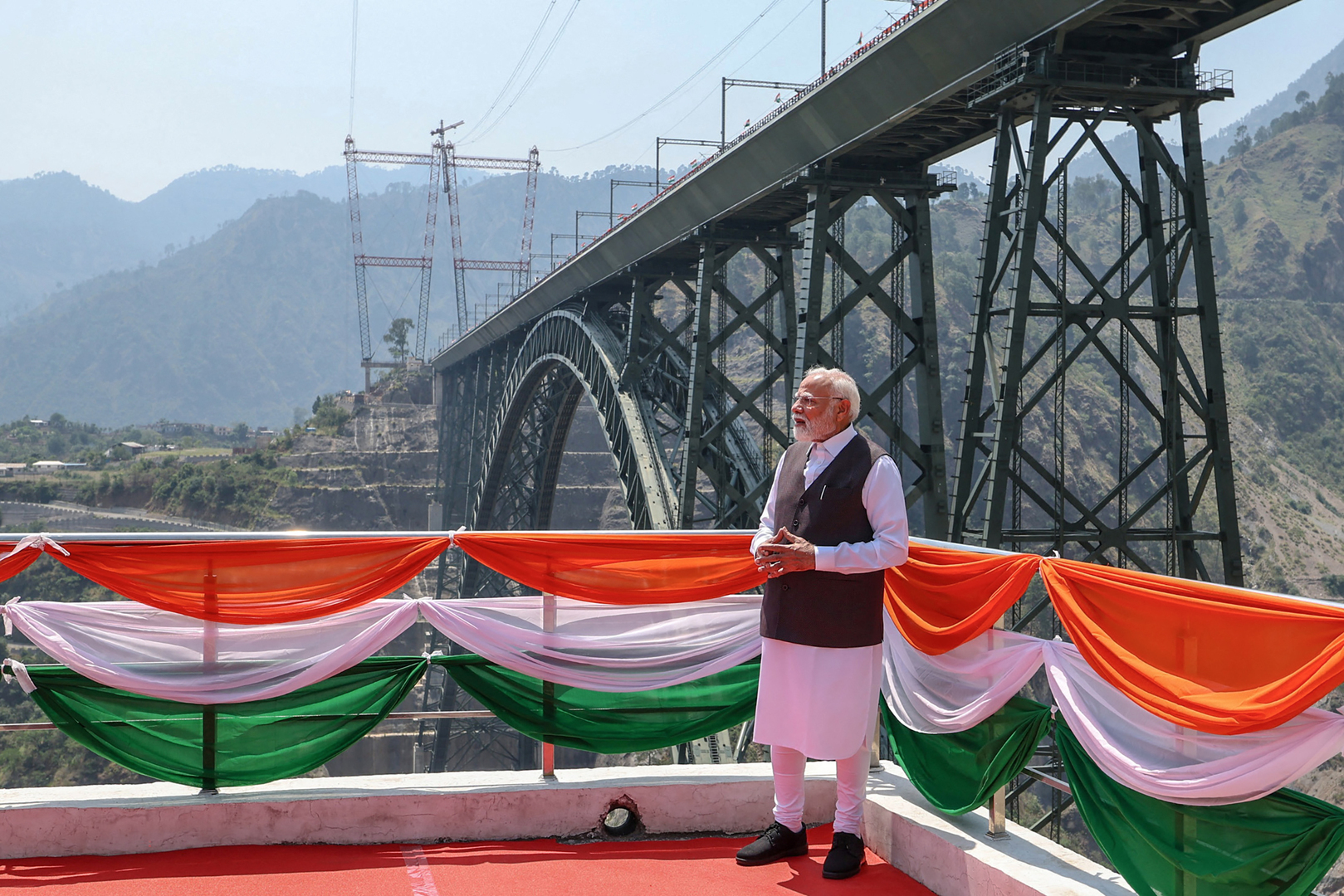 India's Prime Minister Narendra Modi visits the Chenab Rail Bridge during the inauguration of the Kashmir rail link, in Reasi, Jammu and Kashmir [Indian Press Information Bureau (PIB) /Handout via AFP]