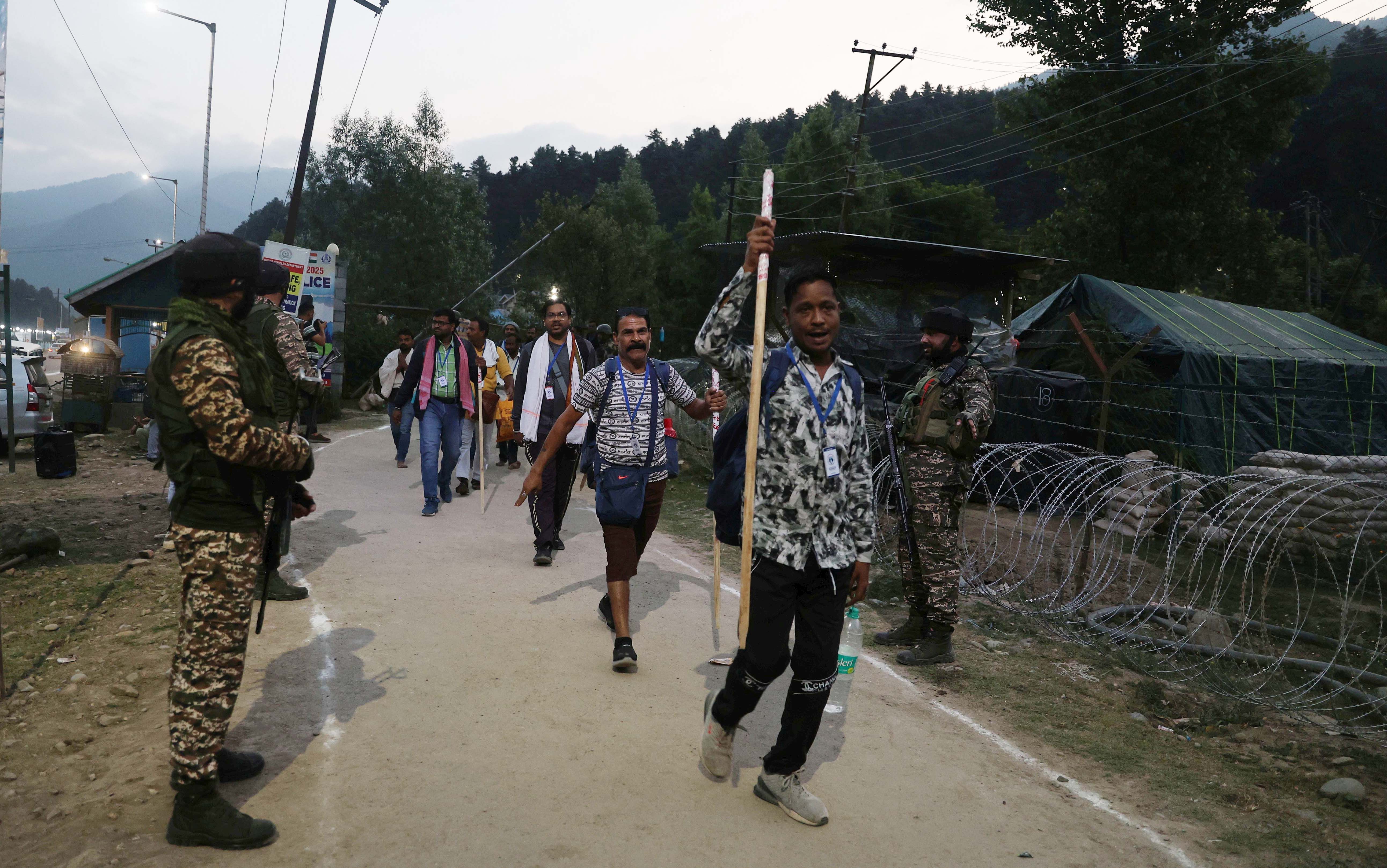 Hindu pilgrims chant religious slogans as they embark on their religious journey.