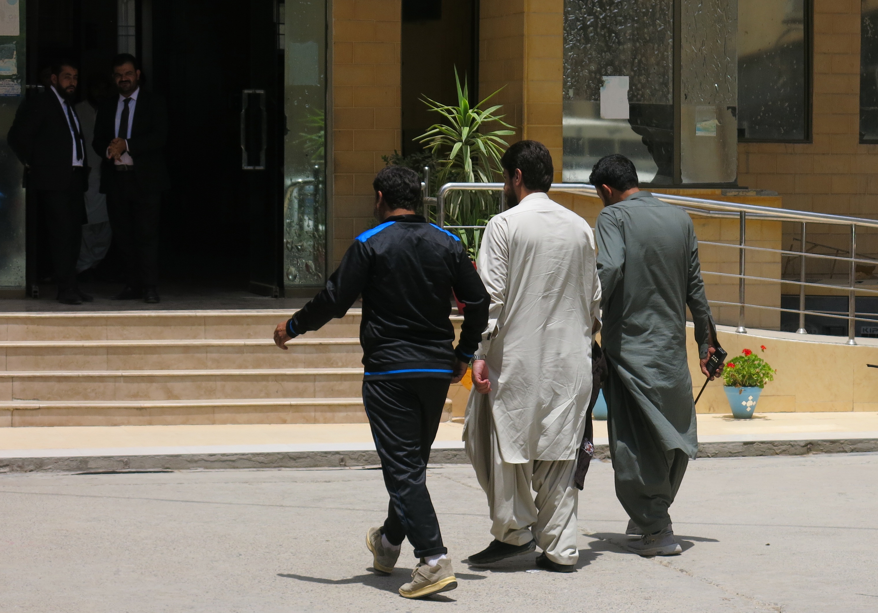 Police officials bring one of the accused in the 'honour killing' case to a court in Quetta, Balochistan, Pakistan, July 21, 2025 [Fayyaz Ahmed/EPA]
