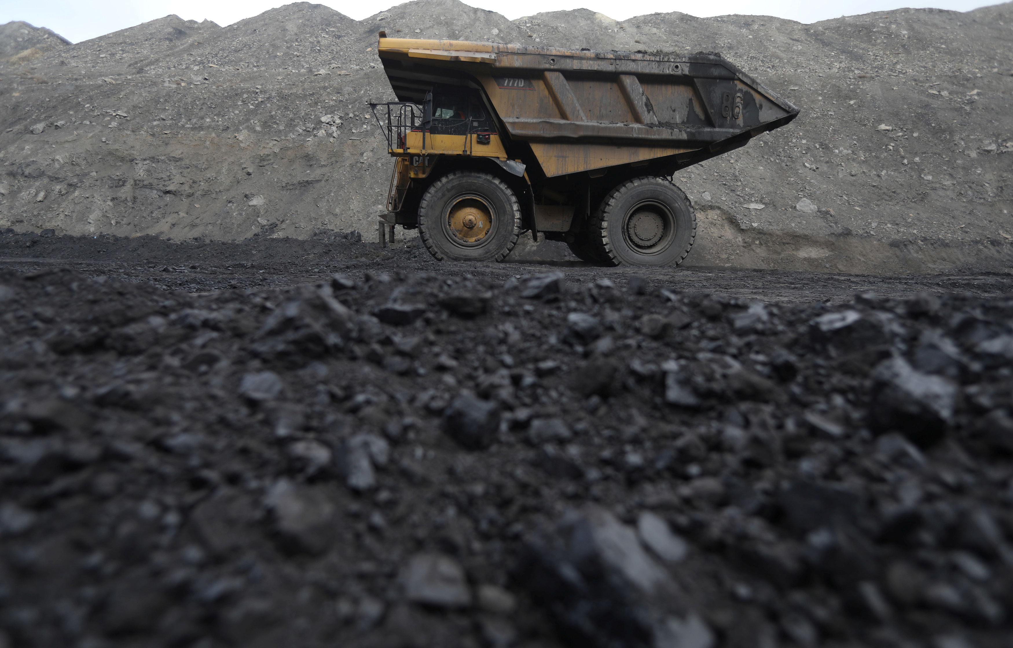 A dump truck atop a pile of coal at Black Butte mine.