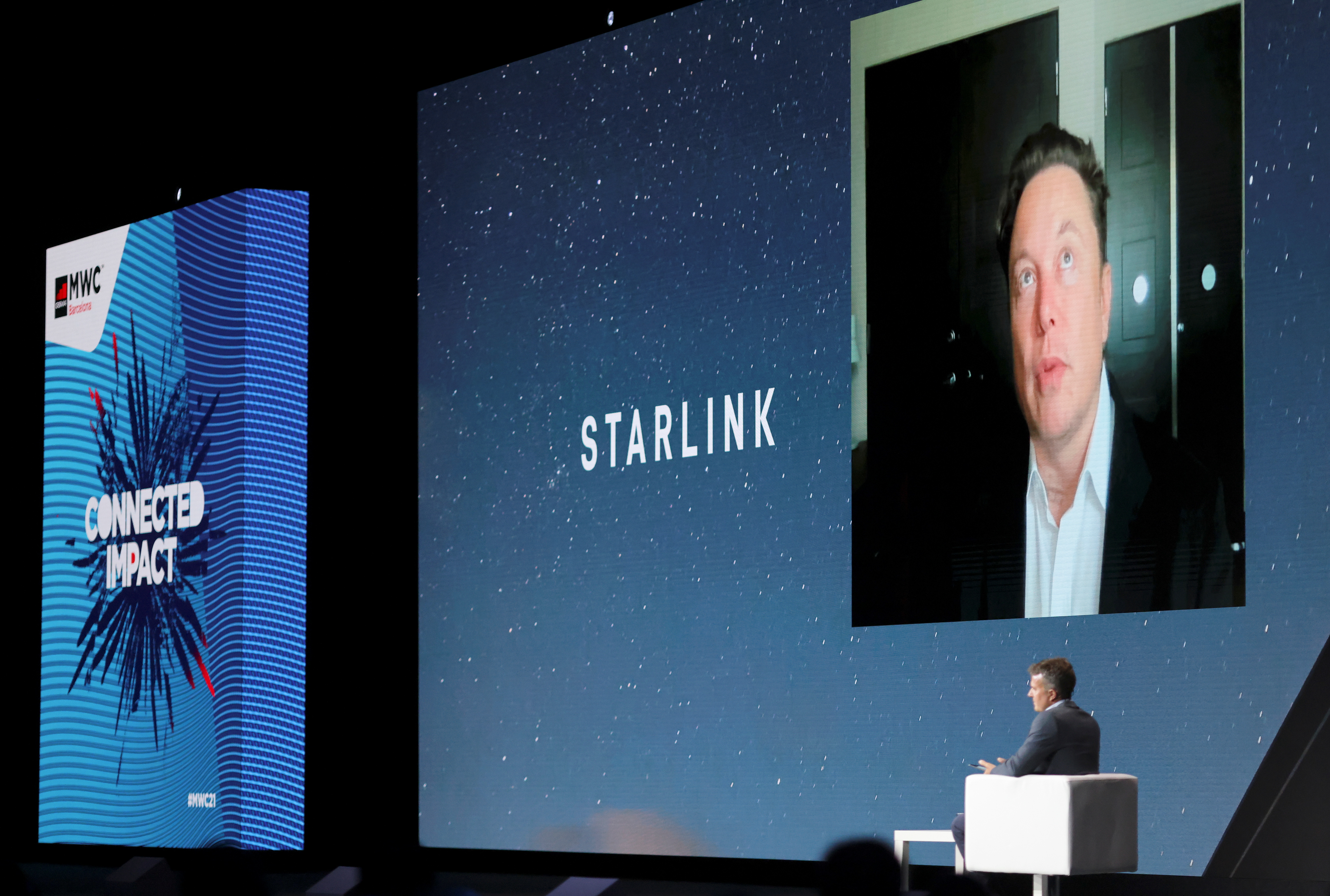SpaceX founder and Tesla CEO Elon Musk speaks on a screen during the Mobile World Congress (MWC) in Barcelona, Spain, June 29, 2021. REUTERS/Nacho Doce