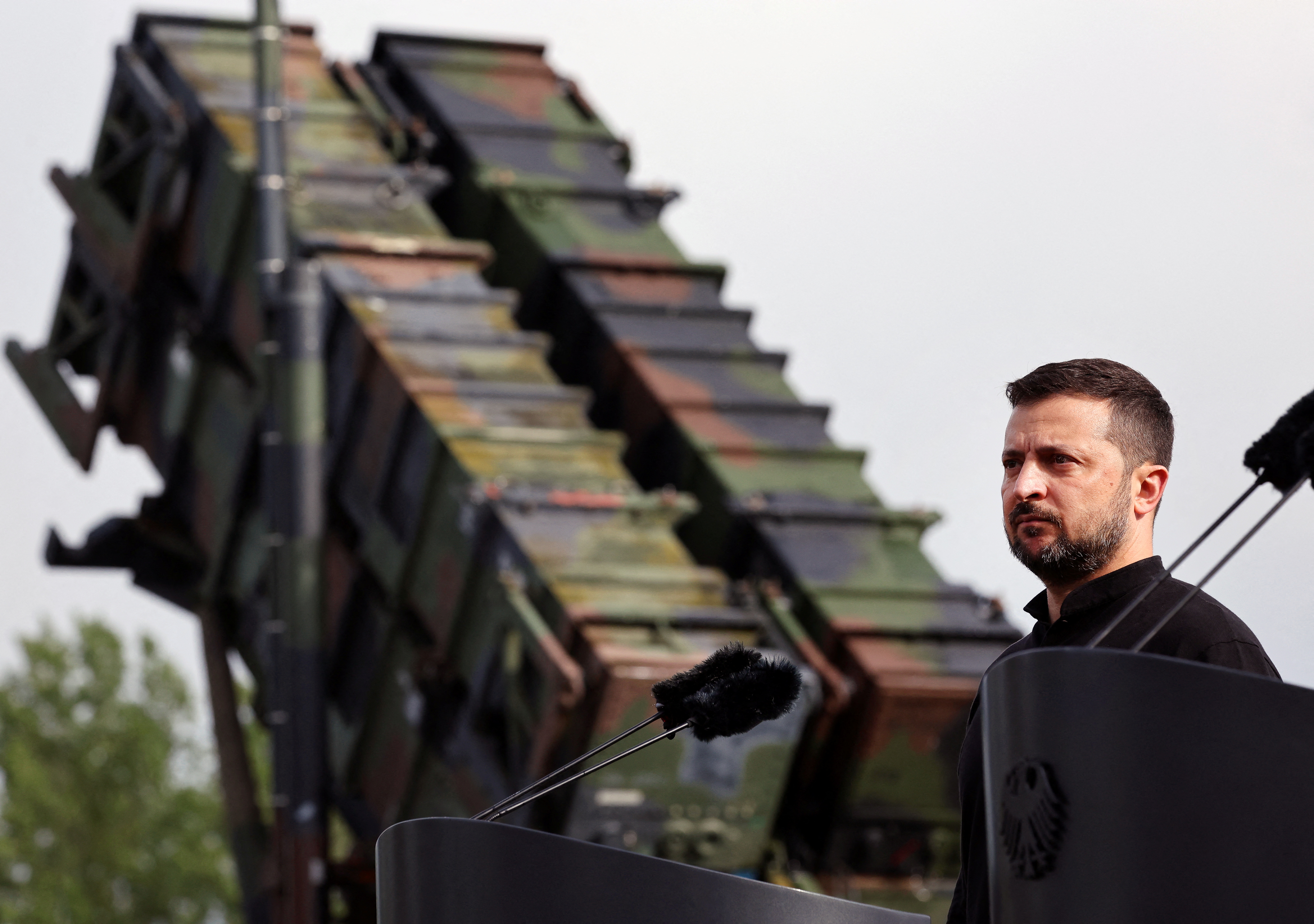 Ukrainian President Volodymyr Zelenskiy looks on during a visit to a military training area to find out about the training of Ukrainian soldiers on the “Patriot” anti-aircraft missile system, at an undisclosed location, in Germany, June 11, 2024. Jens Buttner/Pool via REUTERS