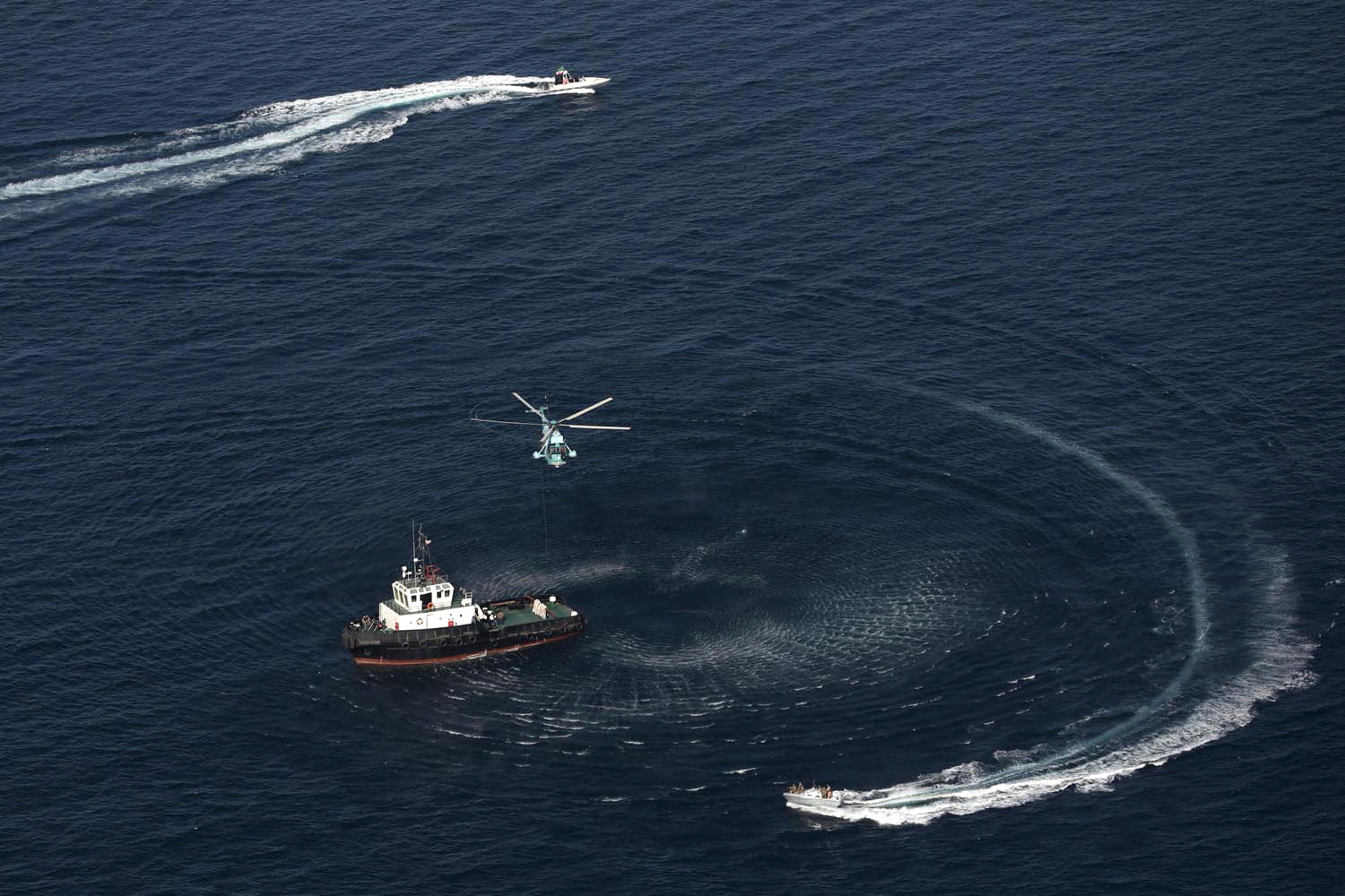 A helicopter flies during the joint Navy exercise of Iran, China and Russia in the Gulf of Oman, Iran, in this handout image obtained on March 12, 2025. Iranian Army/WANA (West Asia News Agency)/Handout via REUTERS ATTENTION EDITORS - THIS IMAGE HAS BEEN SUPPLIED BY A THIRD PARTY