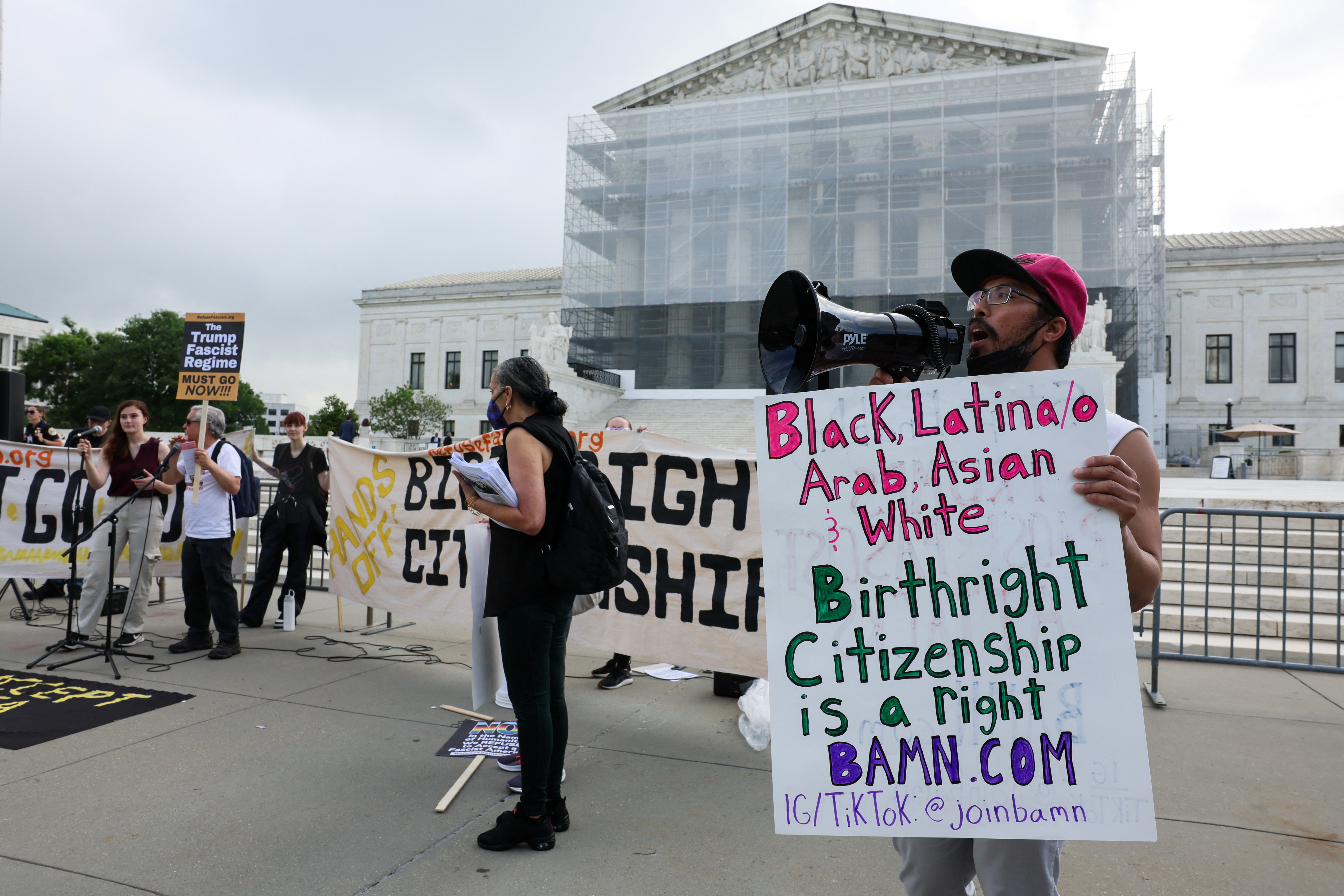Protesters outside the Supreme Court demonstrate against limits to birthright citizenship.