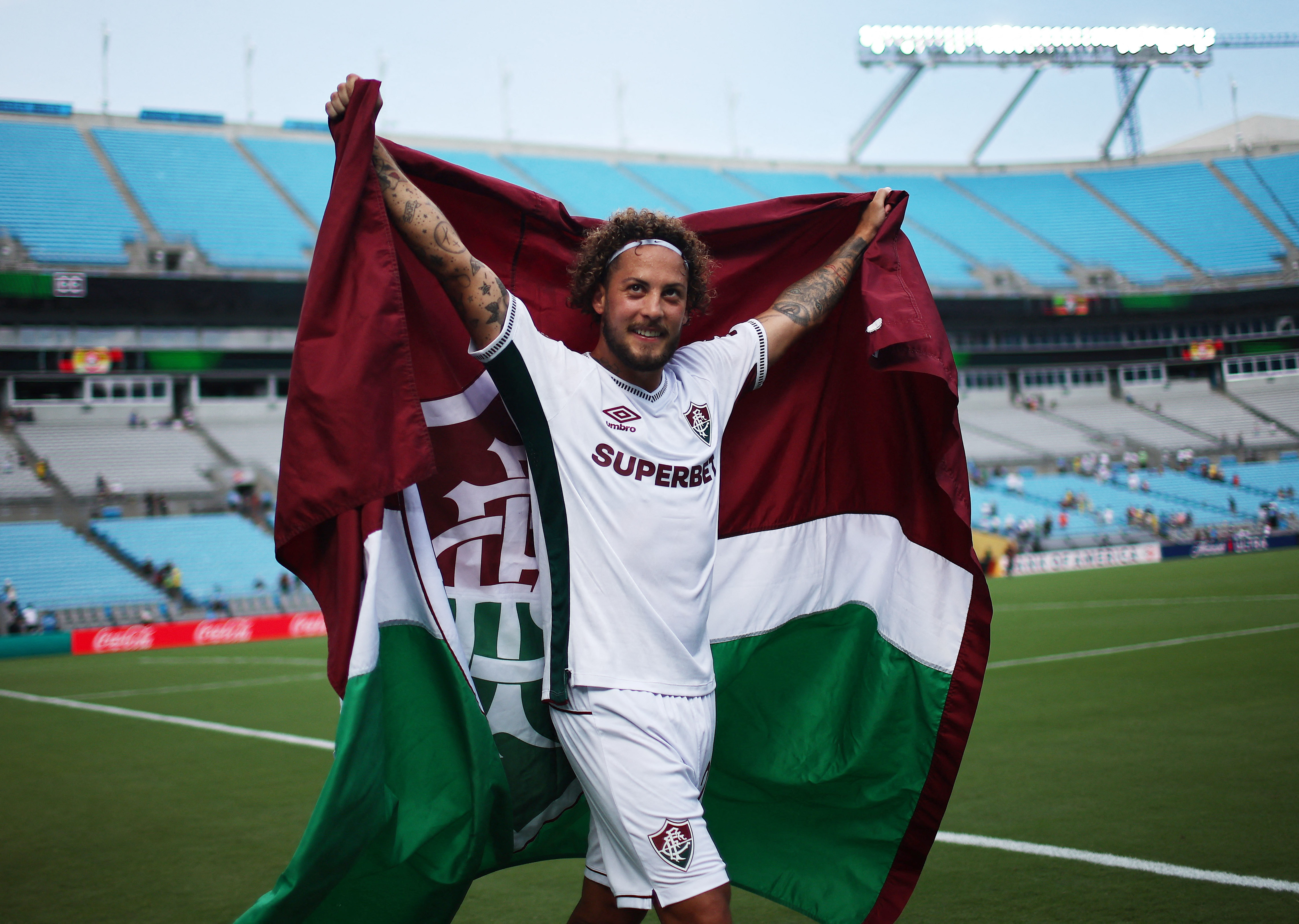 FIFA Club World Cup - Round of 16 - Inter Milan v Fluminense - Bank of America Stadium, Charlotte, North Carolina, U.S. - June 30, 2025 Fluminense's Guga celebrates with a flag after the match
