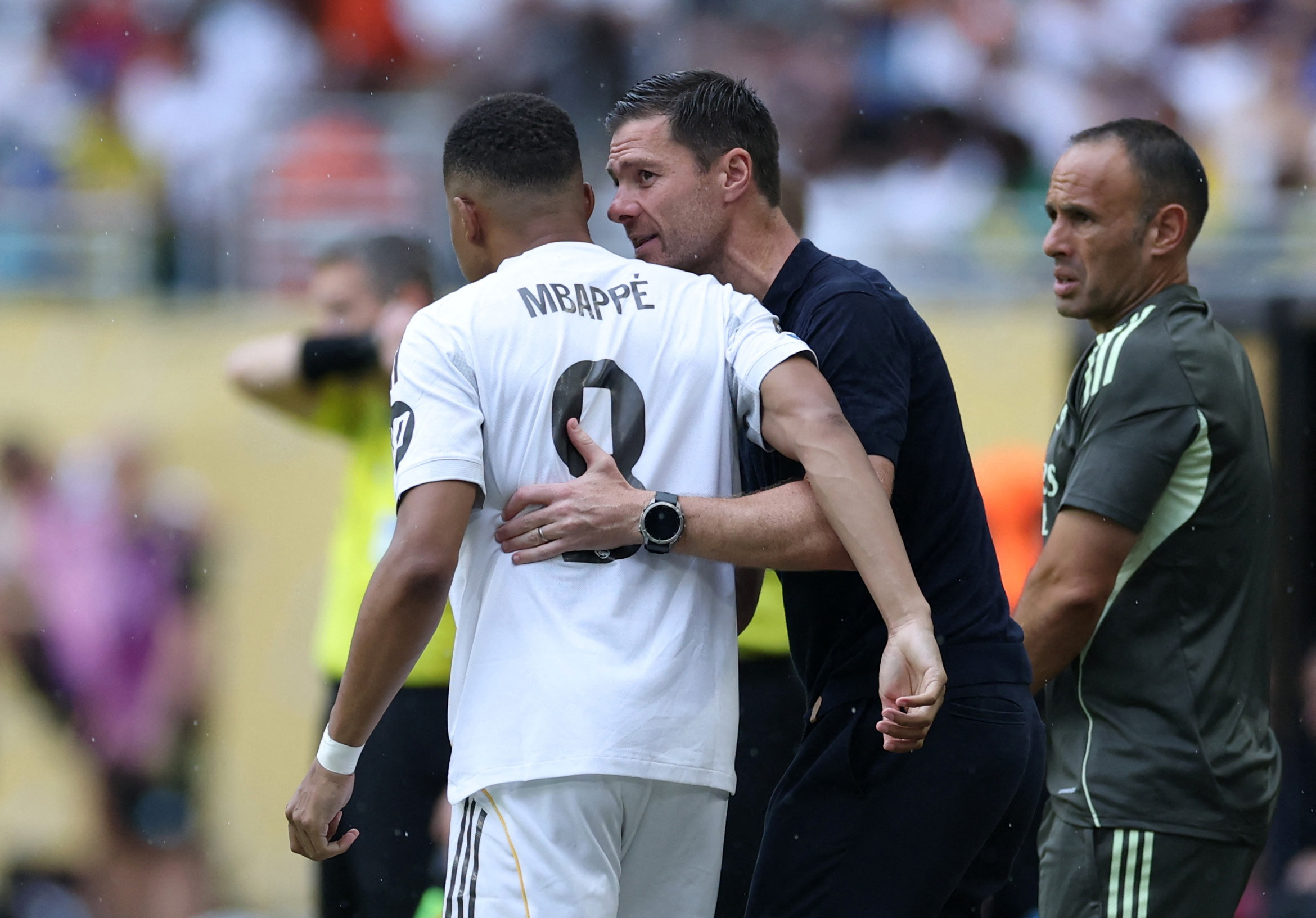 Xabi Alonso and kylian Mbappe react.