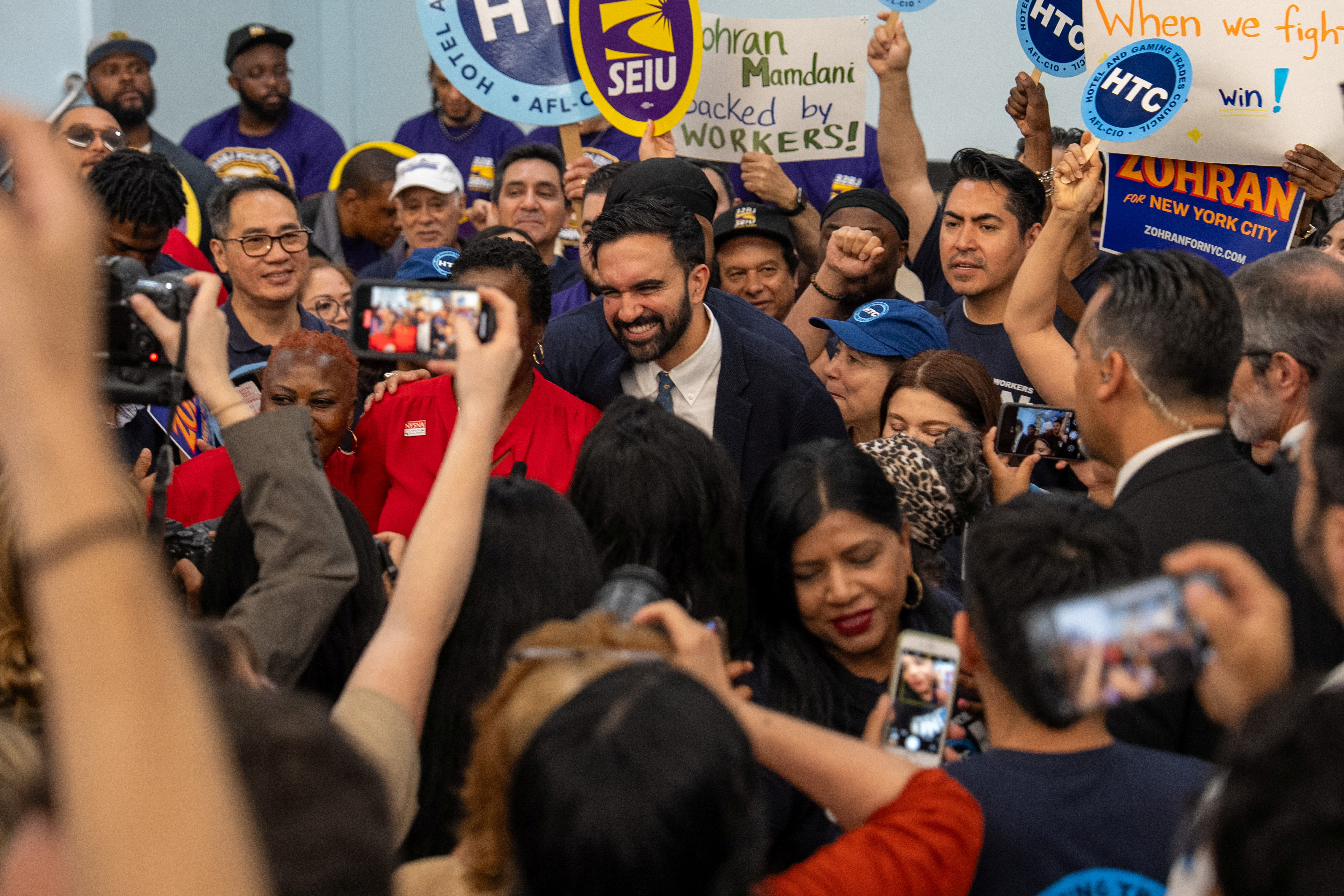 New York City mayoral candidate Zohran Mamdani is surrounded by supporters after a press conference with union leaders in New York City, U.S., July 2, 2025. REUTERS/David 'Dee' Delgado