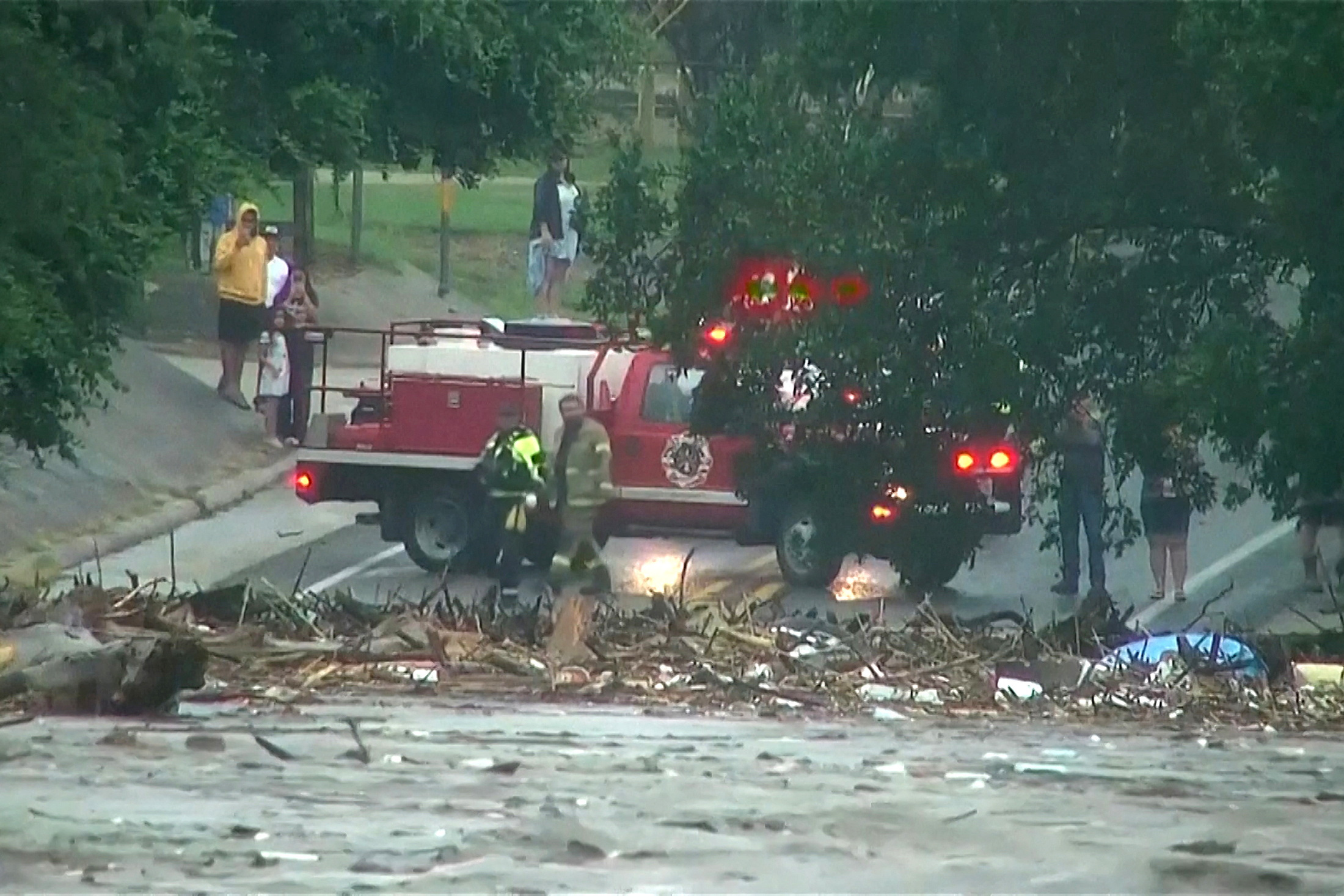 First responders survey rising flood waters of the Guadalupe River after flash flooding in Kerr County, Texas, U.S. July 4, 2025 in a still image from video. ABC Affiliate KSAT via REUTERS. NO RESALES. NO ARCHIVES. THIS IMAGE HAS BEEN SUPPLIED BY A THIRD PARTY