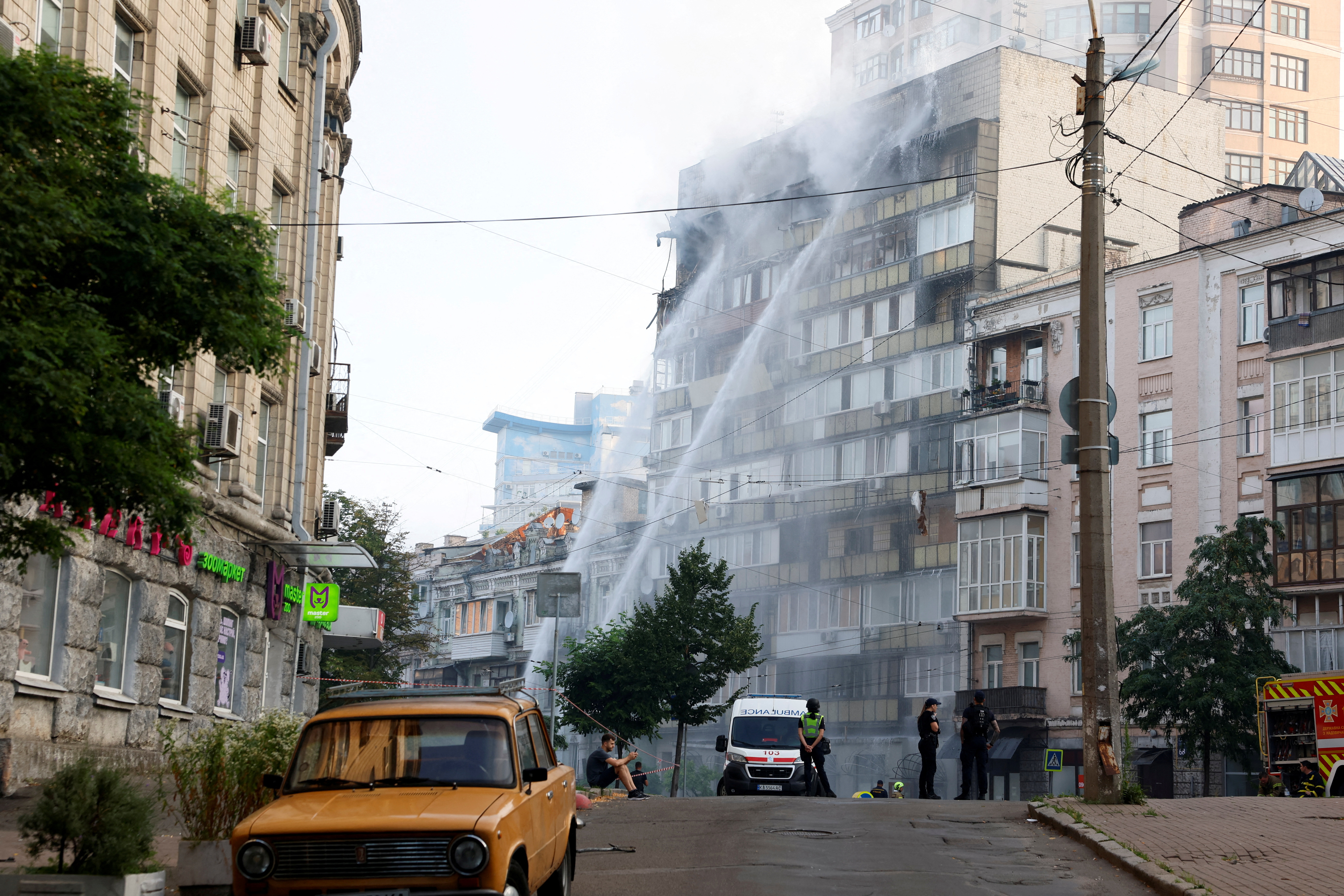 Emergency workers operate at a site of an apartment building that was damaged during Russian drone and missile strikes, amid Russia’s attack on Ukraine, in Kyiv, Ukraine July 10, 2025. REUTERS/Alina Smutko TPX IMAGES OF THE DAY