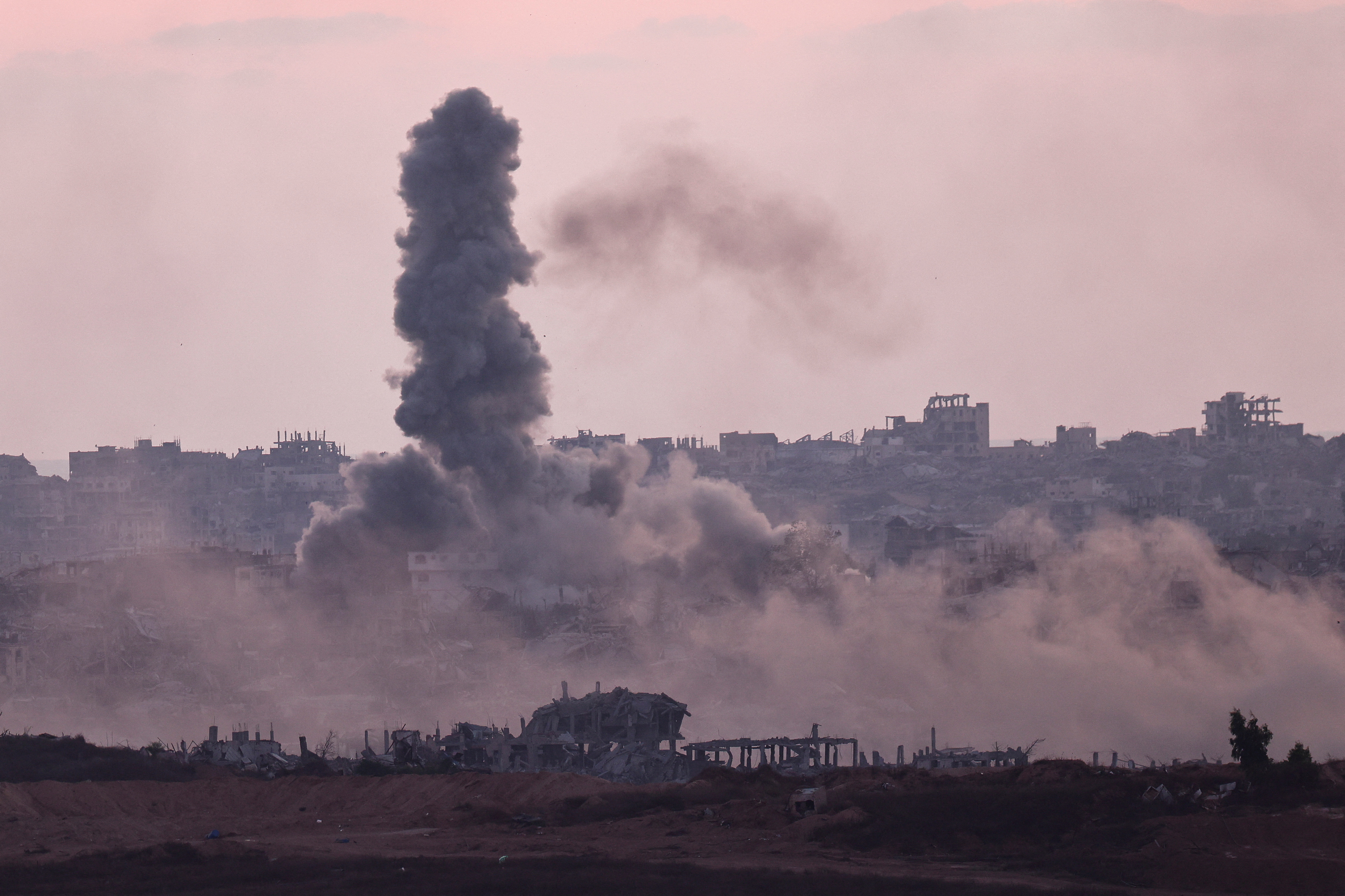 Smoke rises following an explosion in Gaza, as seen from the Israeli side of the Israel-Gaza border, July 13, 2025. [Amir Cohen/Reuters]