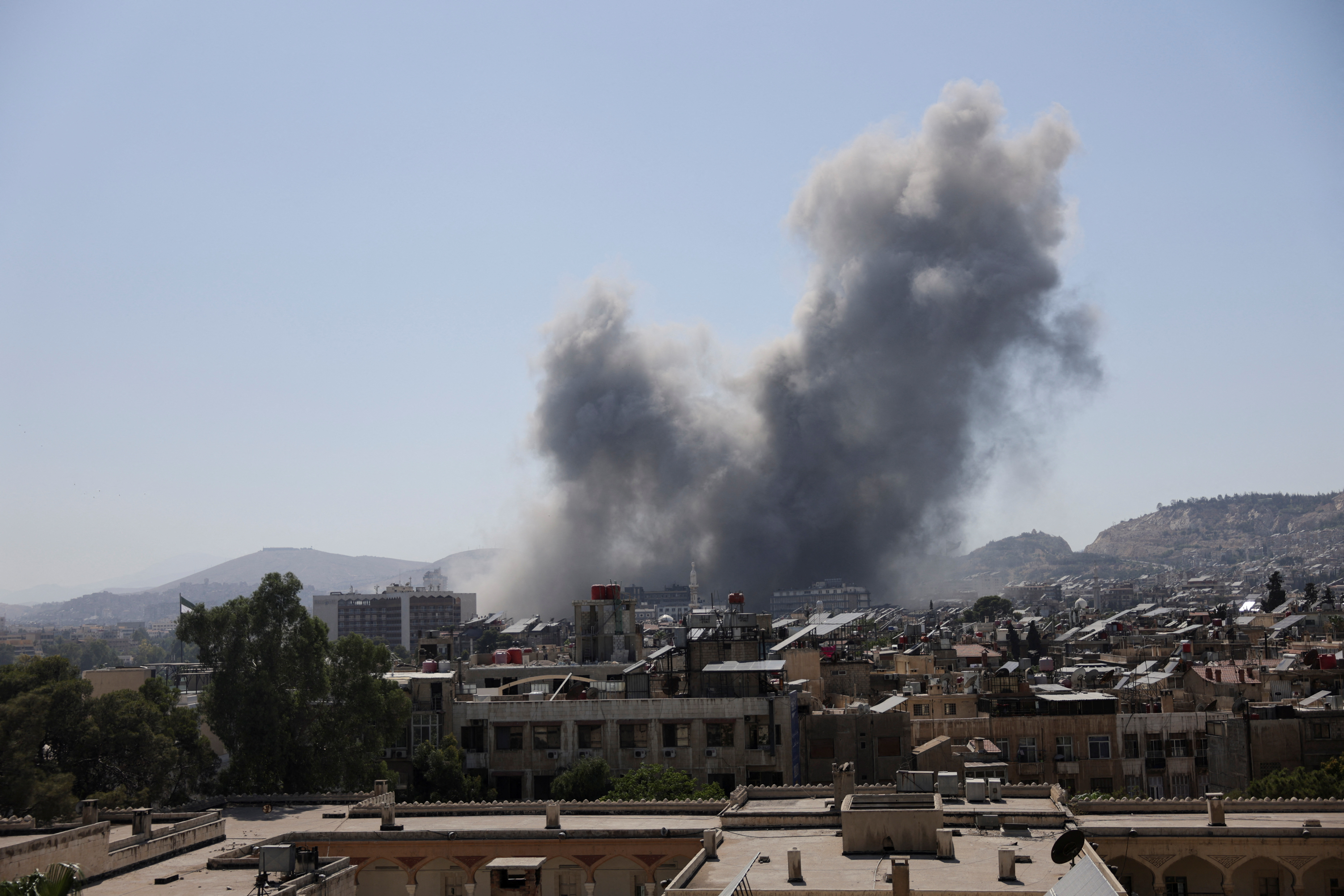 Smoke rises after strikes on Syria's defense ministry in Damascus