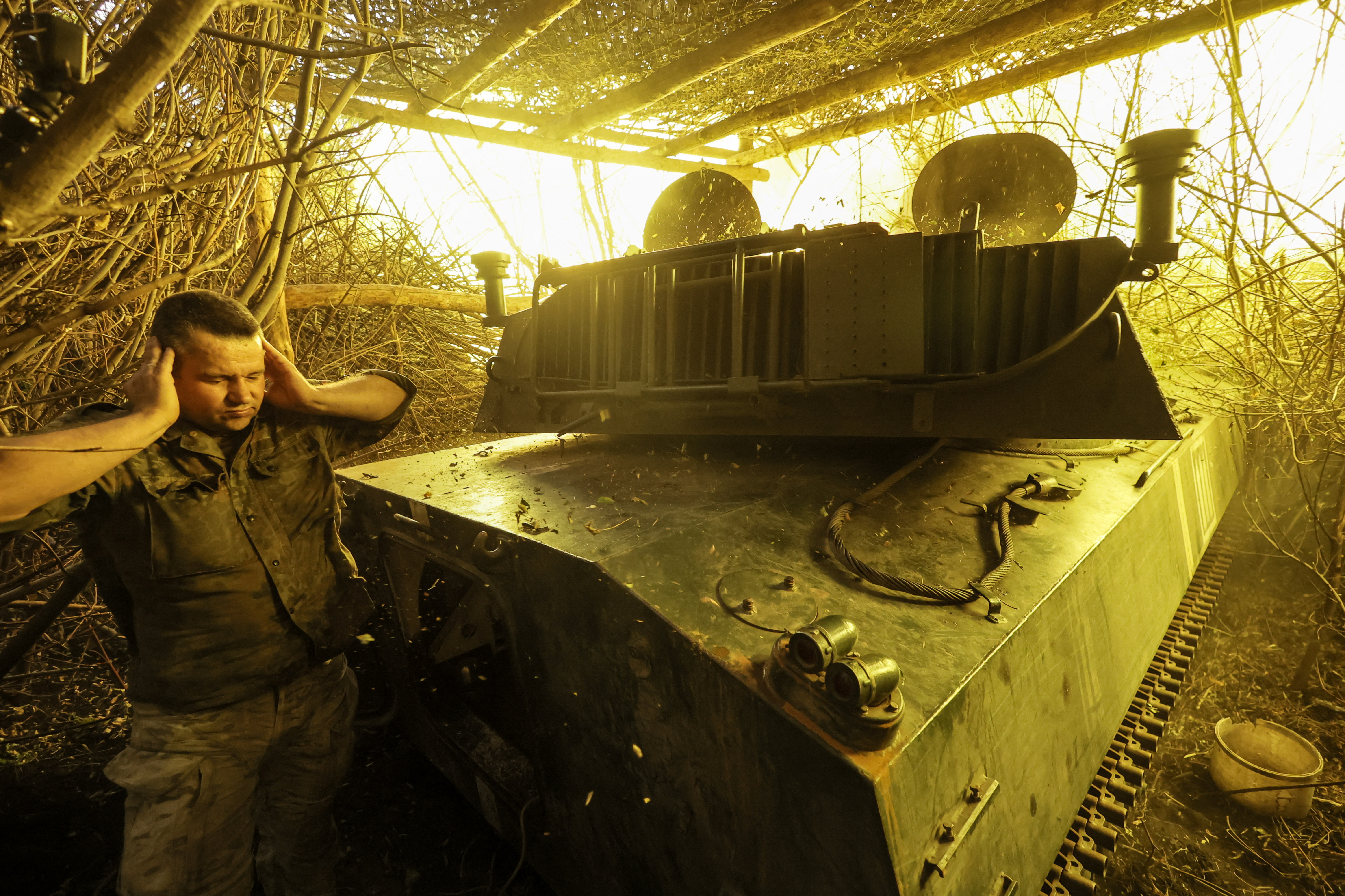 A serviceman of 24th Mechanized brigade of the Ukrainian Armed Forces, named after King Danylo, reacts as they fire a 2S1 Gvozdika self-propelled howitzer towards Russian troops in a front line, amid Russia's attack on Ukraine, near the town of Chasiv Yar in Donetsk region, Ukraine July 22, 2025. Oleg Petrasiuk/Press Service of the 24th King Danylo Separate Mechanized Brigade of the Ukrainian Armed Forces/Handout via REUTERS ATTENTION EDITORS - THIS IMAGE HAS BEEN SUPPLIED BY A THIRD PARTY. TPX IMAGES OF THE DAY
