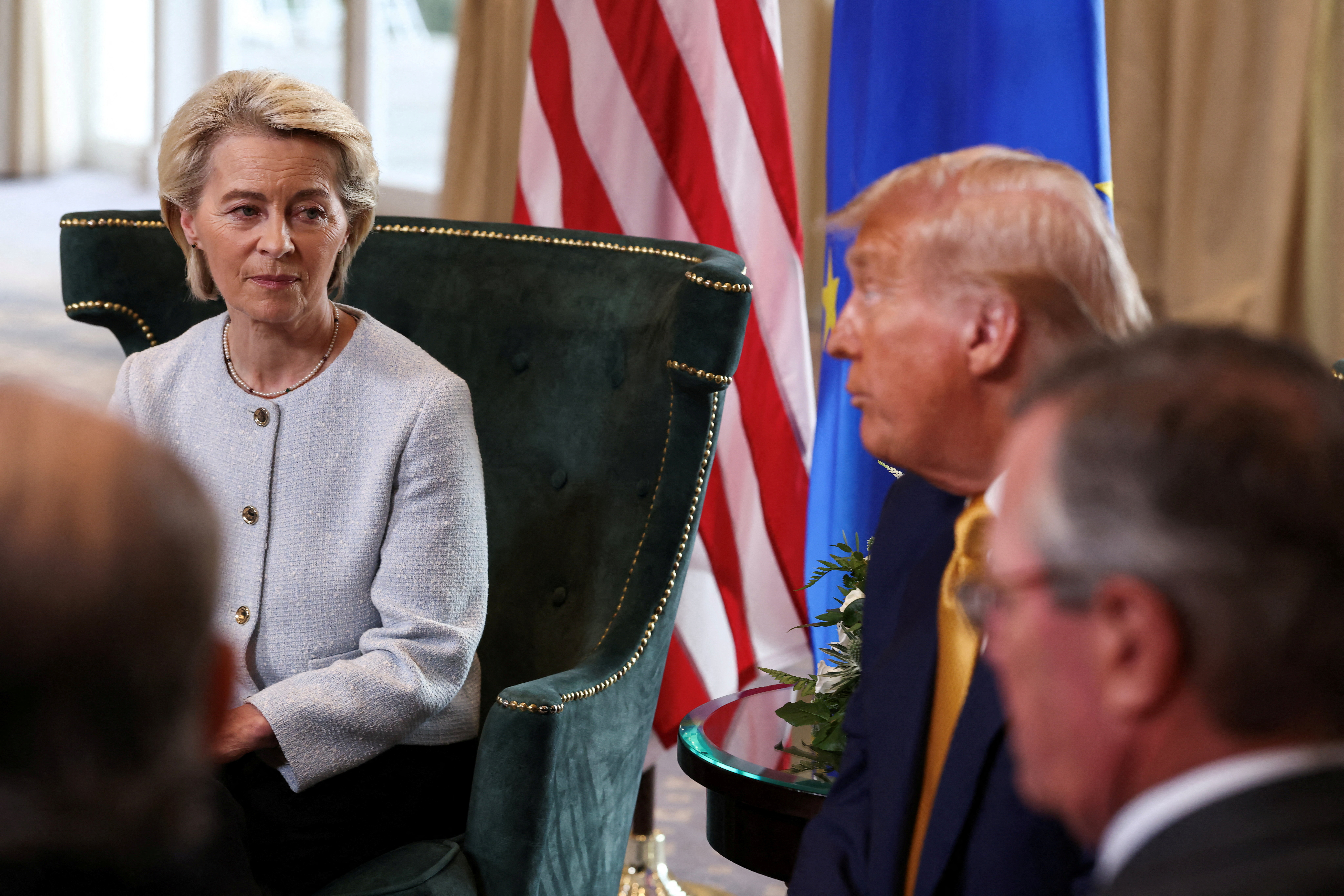 European Commission President Ursula von der Leyen sits with US President Donald Trump, after the announcement of a trade deal between the US and EU, in Turnberry, Scotland, Britain, July 27, 2025. [Evelyn Hockstein/Reuters]