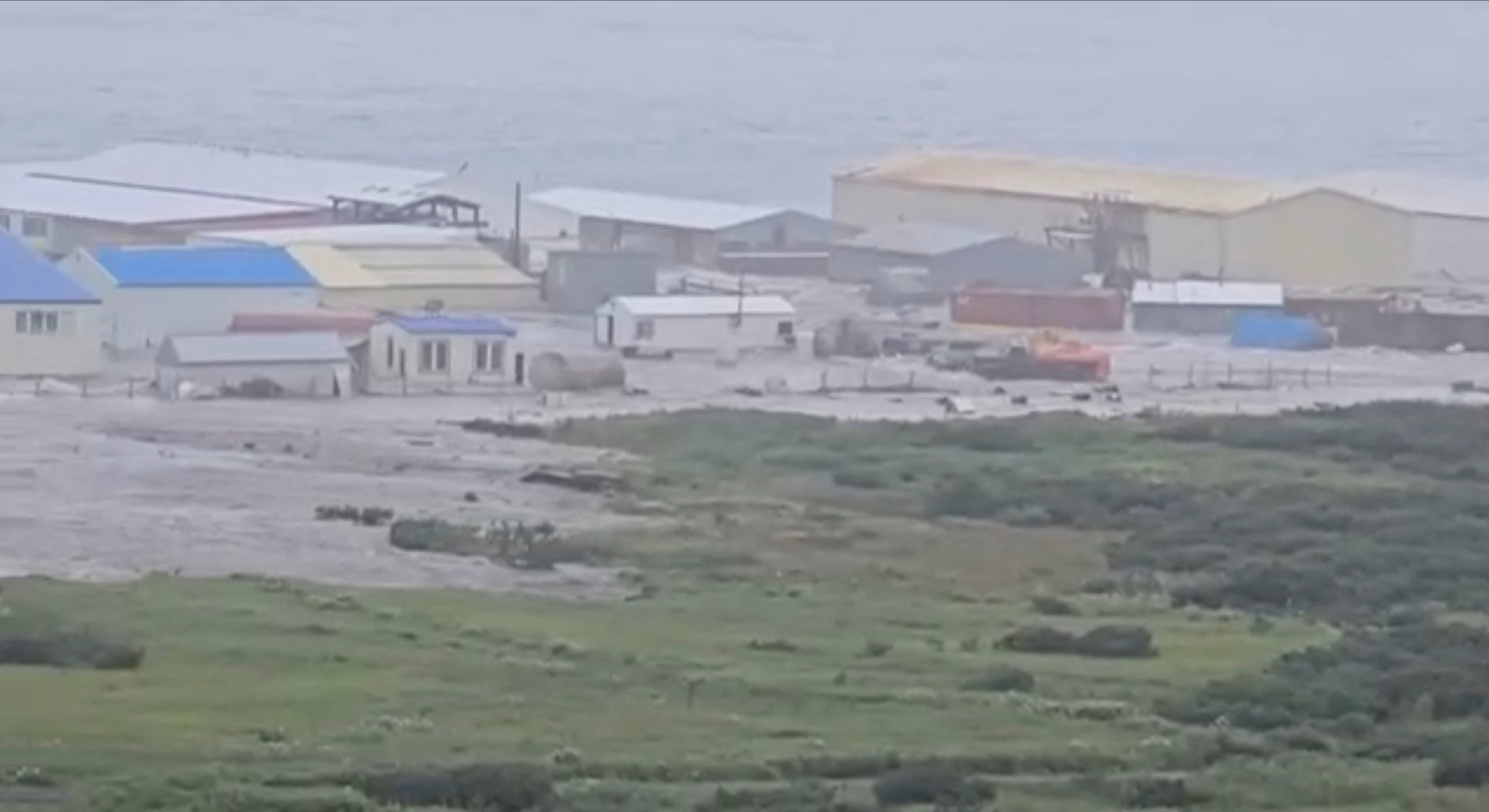 A powerful wave washes past a building located near the shore, after a powerful earthquake struck off the Kamchatka Peninsula, in Severo-Kurilsk, Sakhalin Region, Russia July 30, 2025 in this screen grab obtained from social media video Social media/via REUTERS THIS IMAGE HAS BEEN SUPPLIED BY A THIRD PARTY. NO RESALES. NO ARCHIVES. NEWS USE ONLY Reuters was able to confirm the location by buildings, water body and terrain which match with satellite images. Reuters was able to confirm the date by the corroborating local reports and official statements