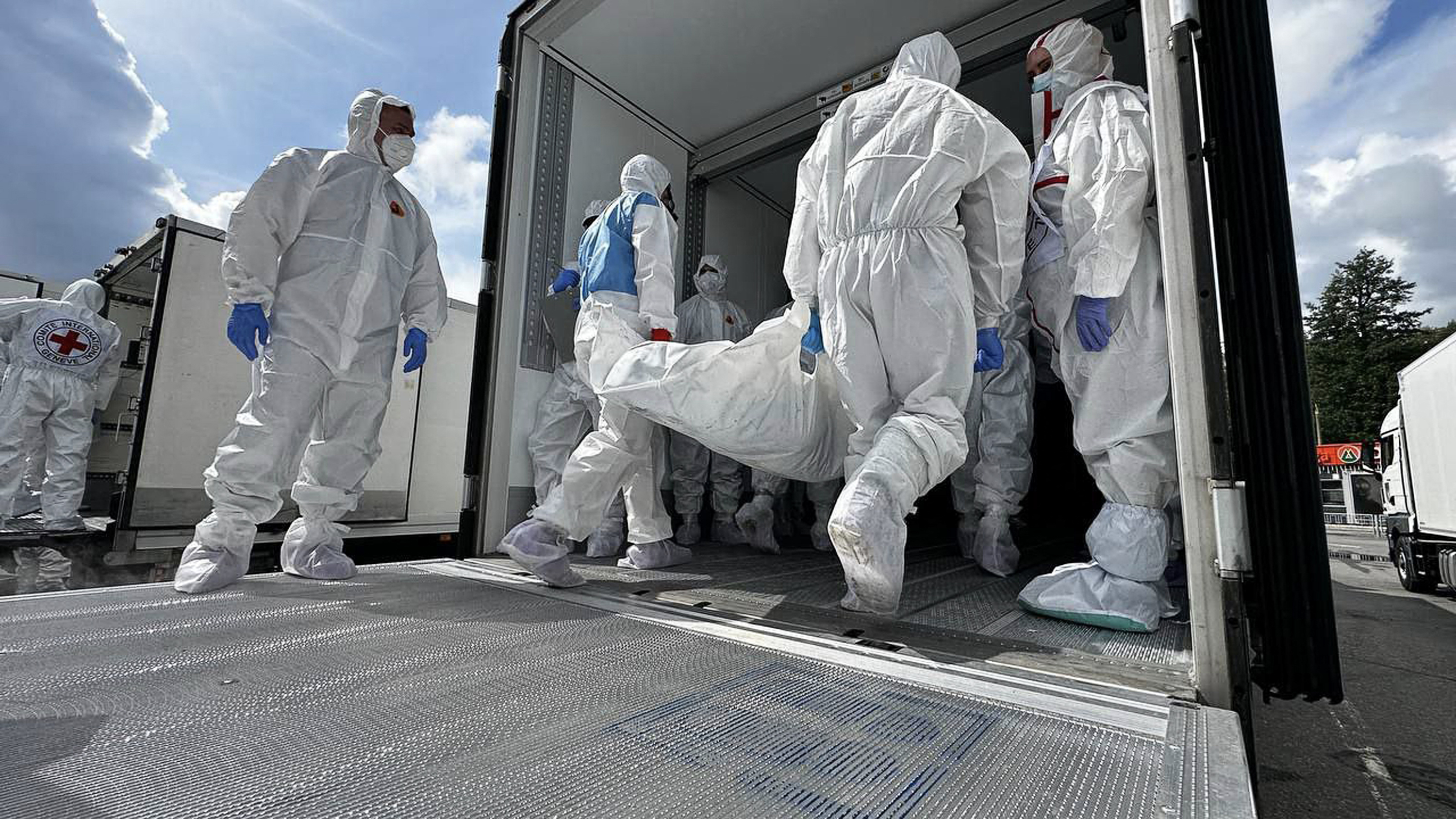 This handout picture taken and released by the official Telegram Channel of top Russian negotiator and Kremlin aide Vladimir Medinsky shows a body exchange procedure taking place on July 17, 2025 in an undisclosed location at Belarus-Ukraine border.