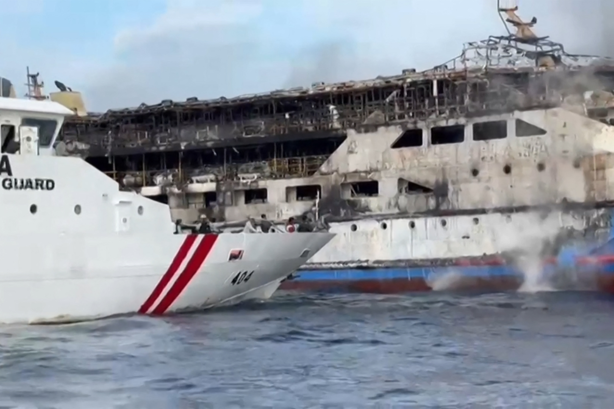This screengrab from a video released by Indonesia's National Search and Rescue Agency and the Indonesian coastguard on July 20, 2025 shows the KM Barcelona 5 ferry after a fire broke out