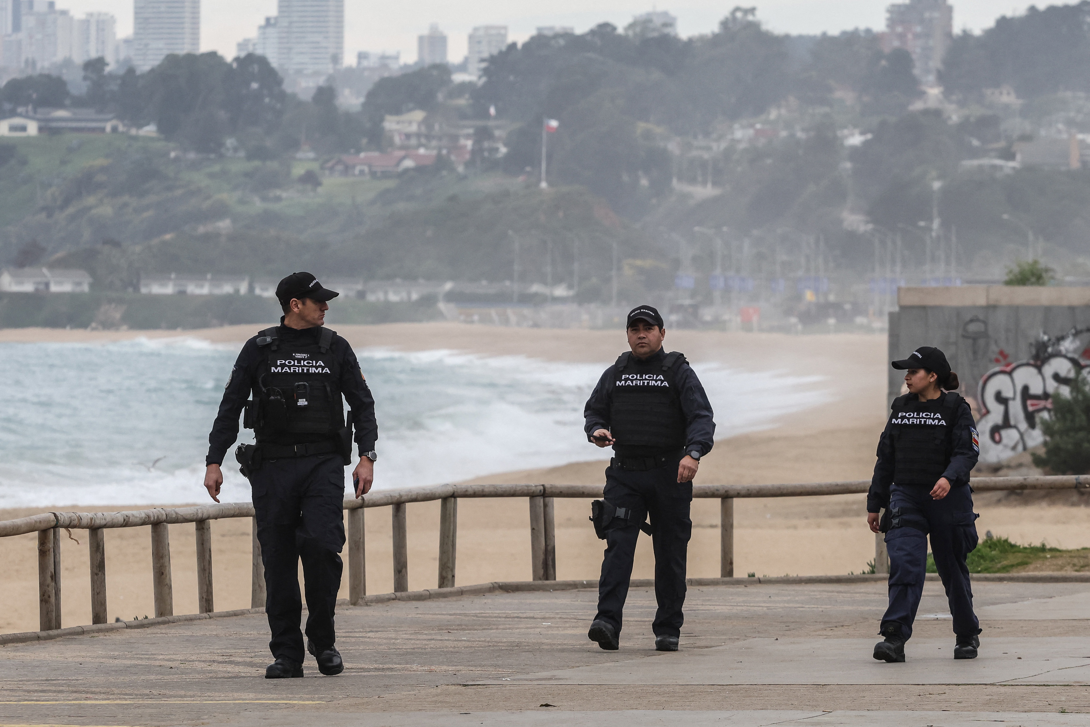 Members of the Chilean police force patrol the coastal area during an evacuation due to a tsunami warning in Viña del Mar, Chile on July 30, 2025. Chile warned on July 29, 2025, of a "high probability" of a tsunami in the country as a result of an 8.8 magnitude earthquake off the coast of Russia, the Navy reported. (Photo by CRISTOBAL BASAURE / AFP)