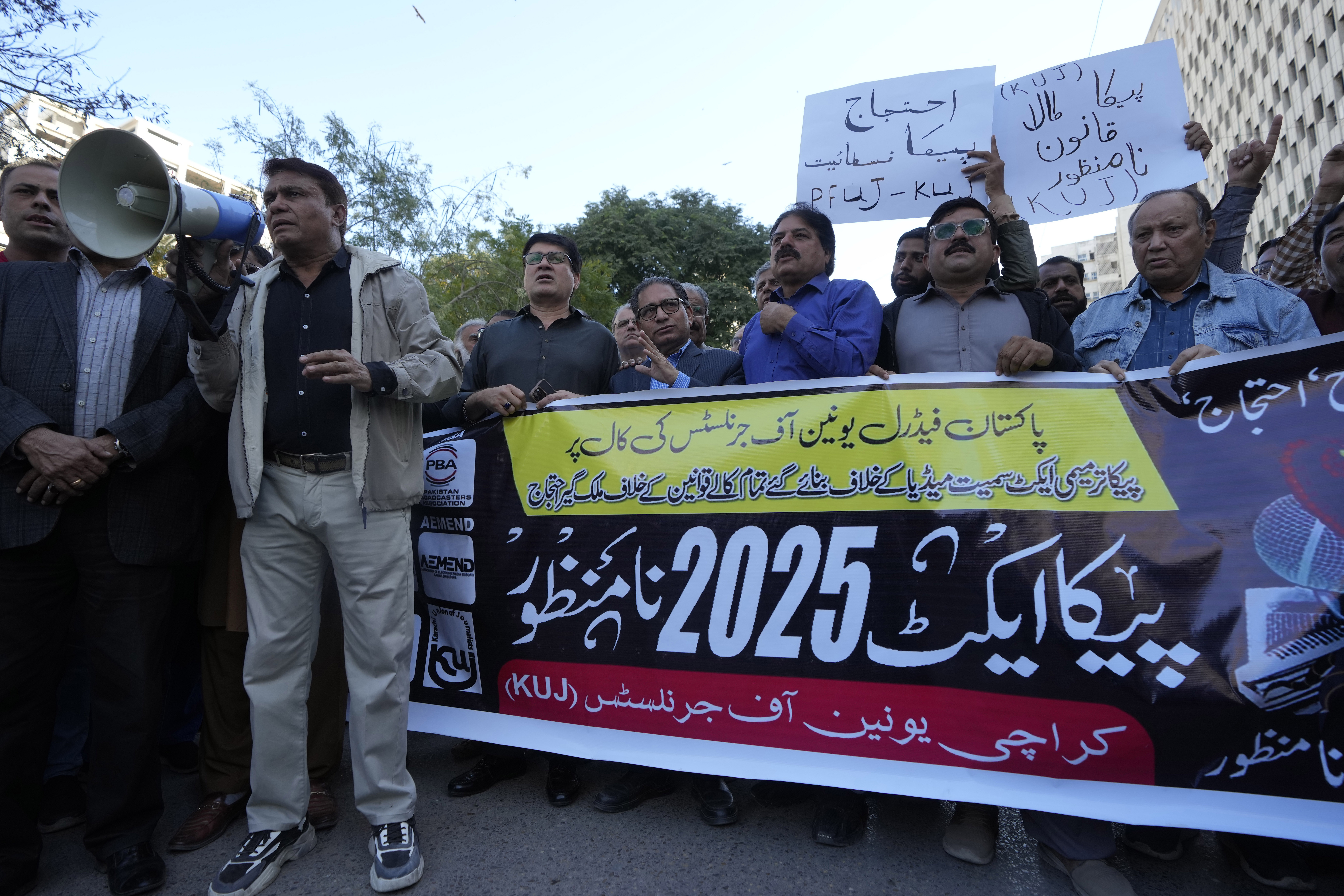 Journalists chant slogans during a demonstration in Karachi, Pakistan, Tuesday, Jan. 28, 2025, to condemn a controversial 'Prevention of Electronic Crimes Act' bill passed by parliament that critics argue is designed to suppress freedom of speech. (AP Photo/Fareed Khan)