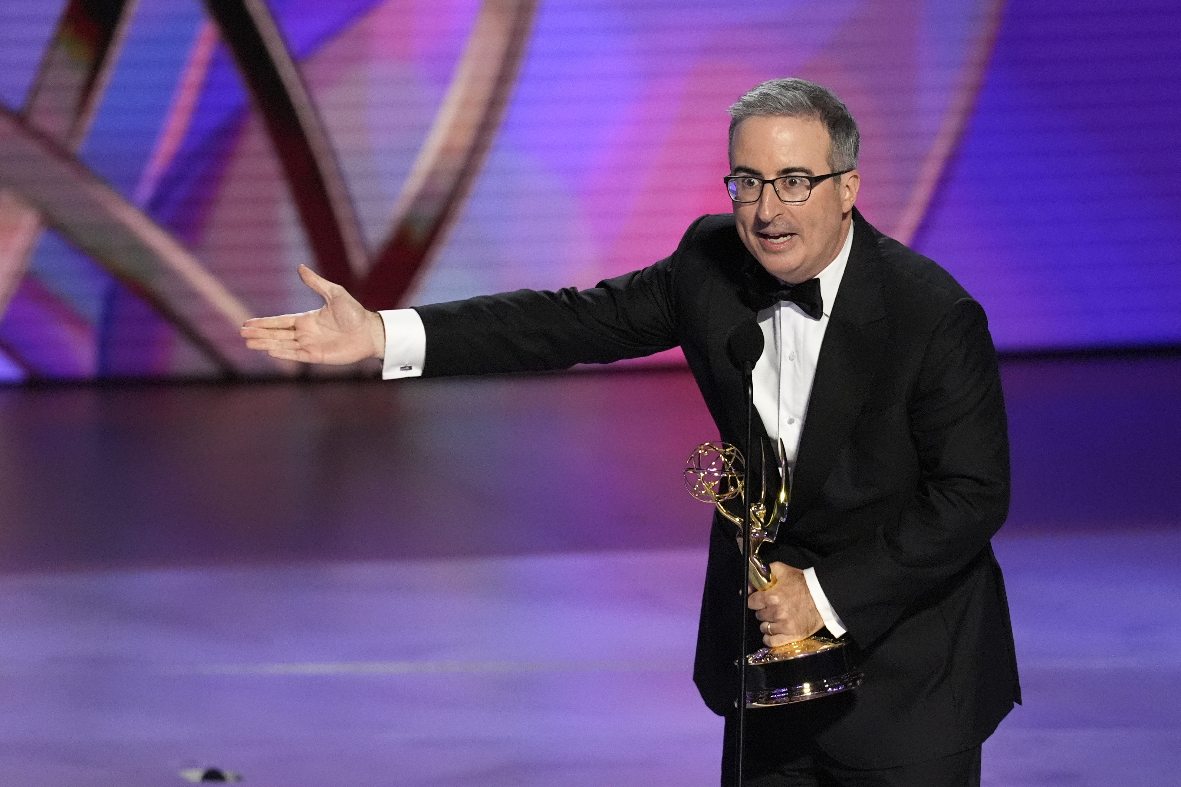 John Oliver accepts the award for outstanding scripted variety series for "Last Week Tonight With John Oliver" during the 76th Primetime Emmy Awards on Sunday, Sept. 15, 2024, at the Peacock Theater in Los Angeles