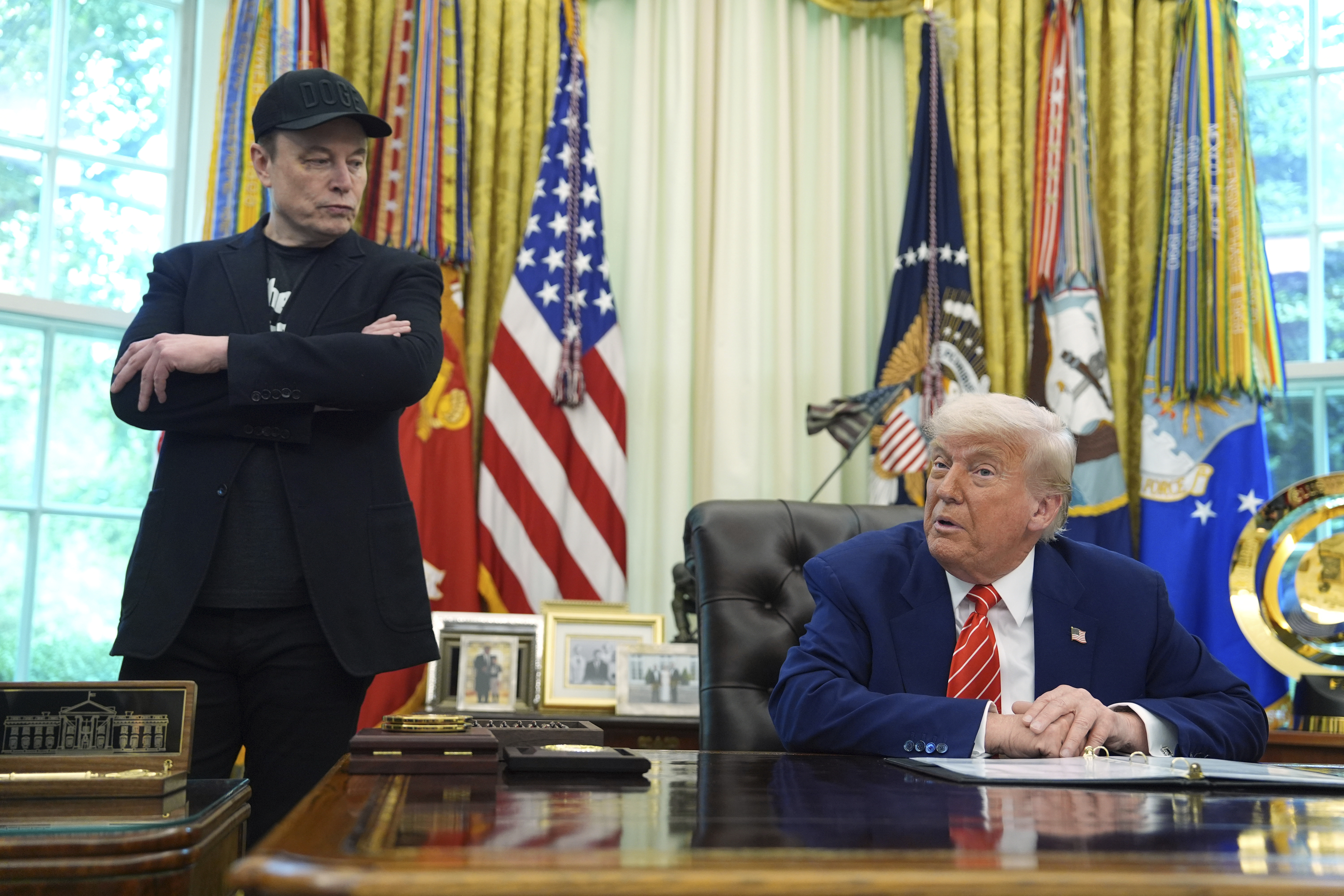 FILE - President Donald Trump, right, speaks during a news conference with Elon Musk in the Oval Office of the White House, Friday, May 30, 2025, in Washington