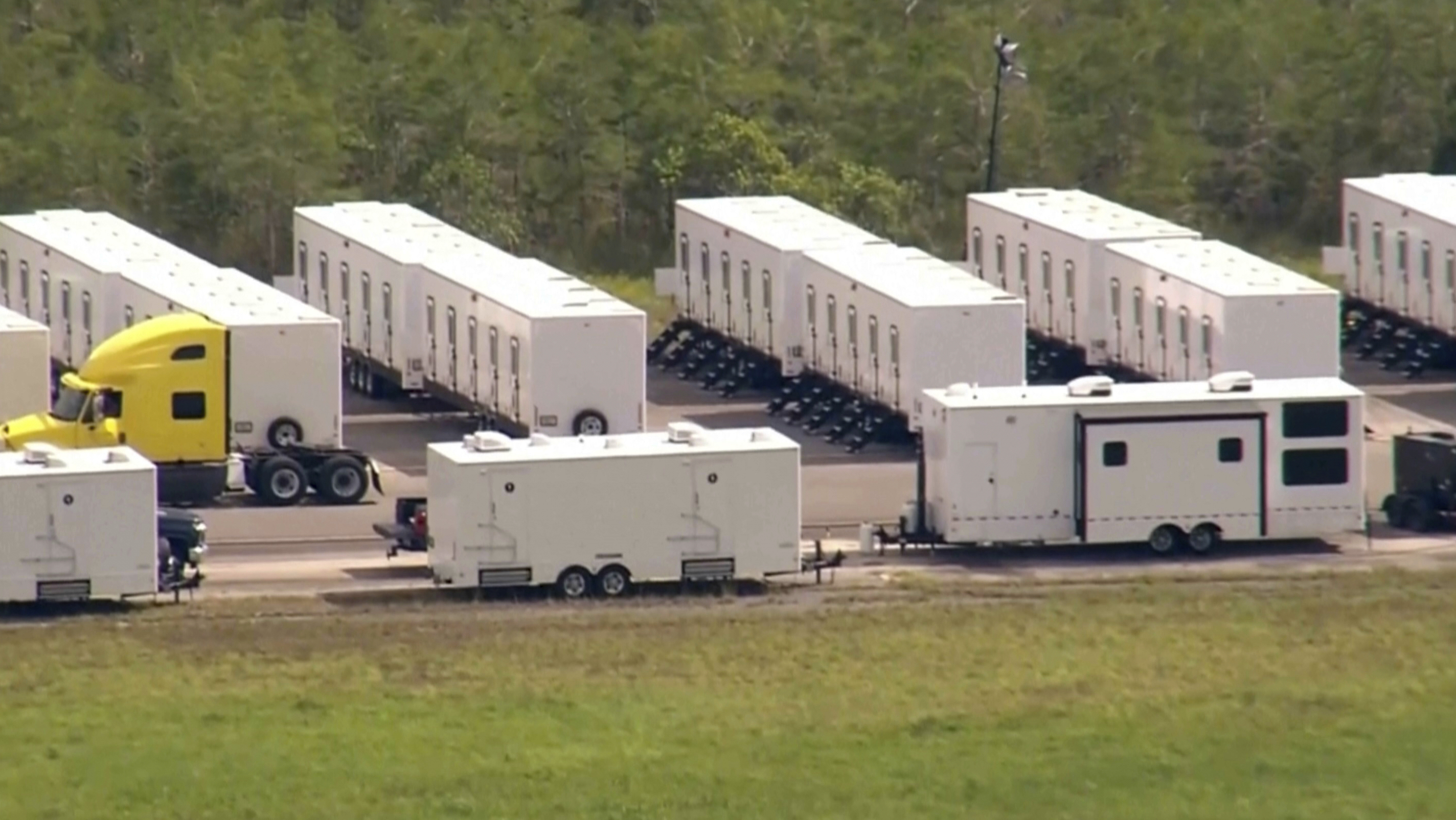 Modular containers are lined up at the Everglades air strip dubbed "Alligator Alcatraz."