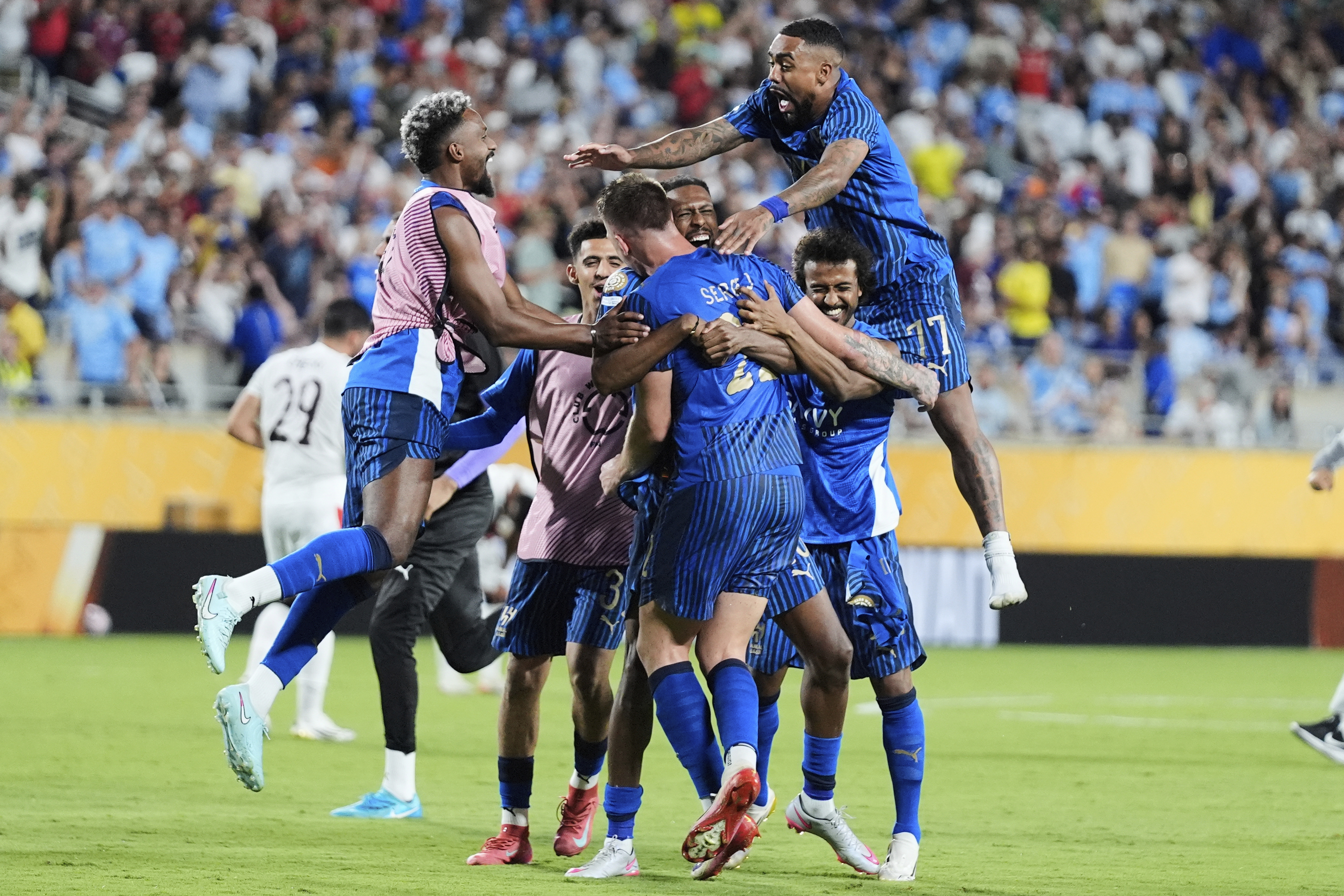 Al Hilal players celebrate following the Club World Cup round of 16 soccer match between Manchester City and Al Hilal in Orlando, Fla., Monday, June 30, 2025. (AP Photo/John Raoux)