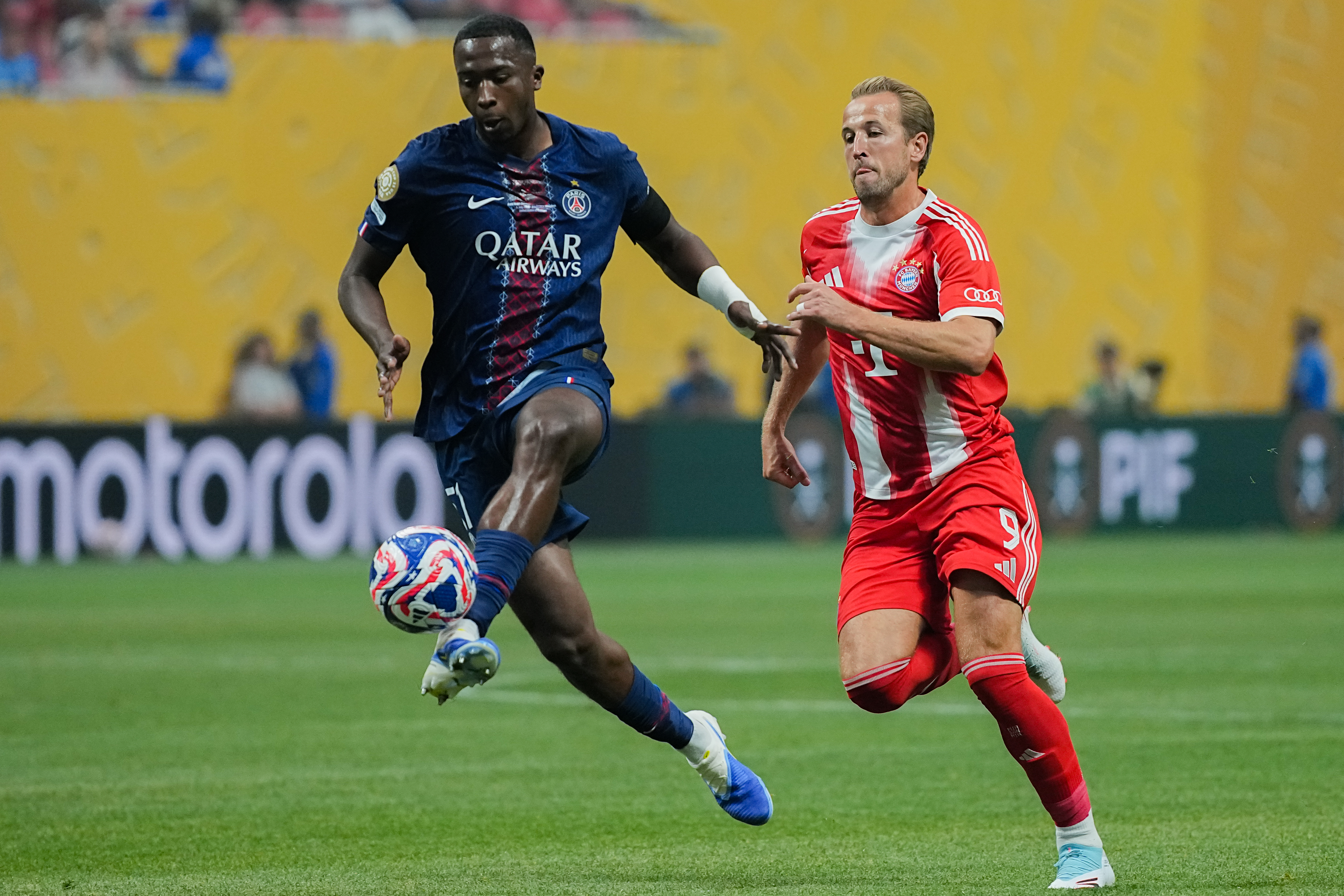 Ousmane Dembele and Harry Kane in action.