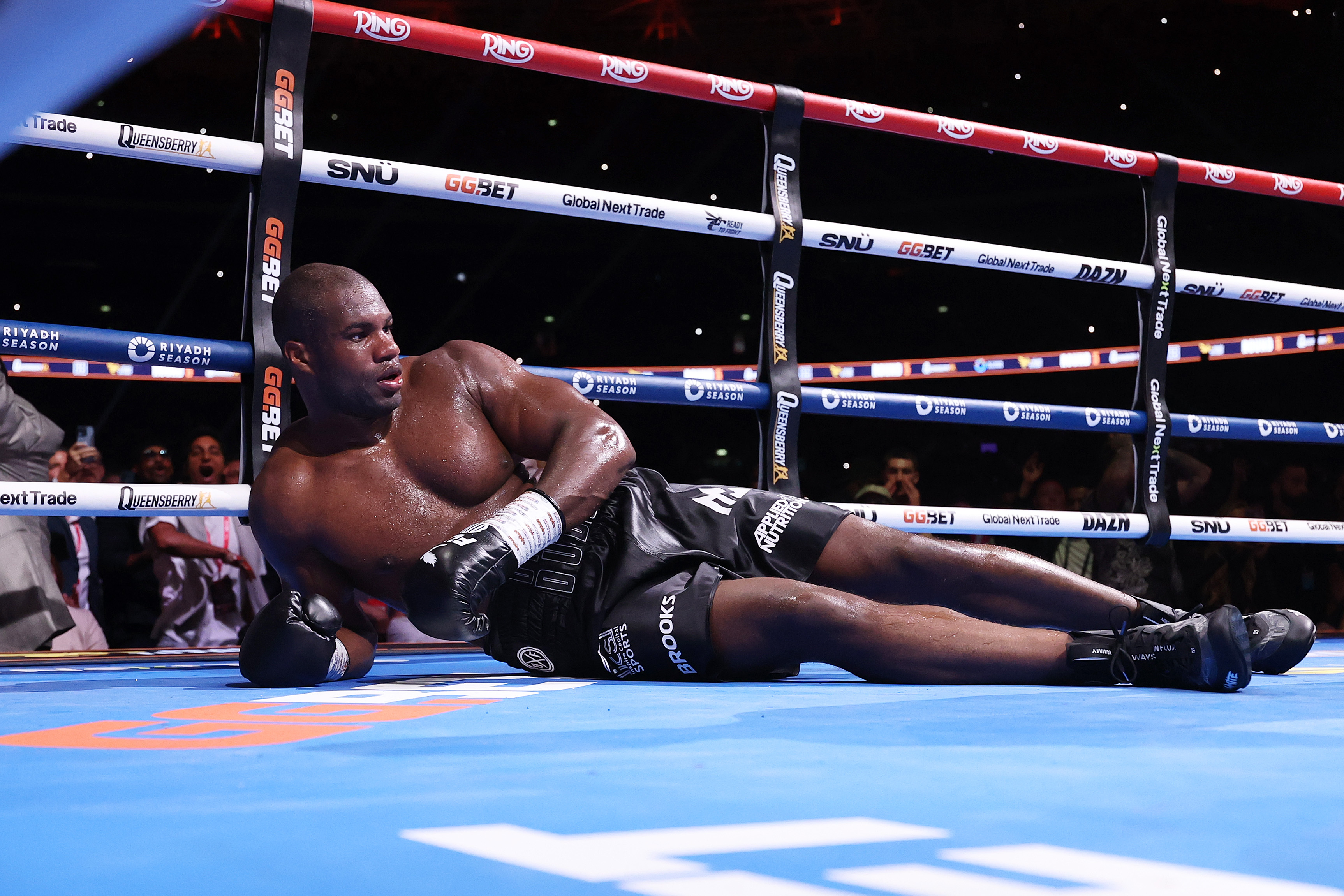 Daniel Dubois looks on after being knocked down by Oleksandr Usyk