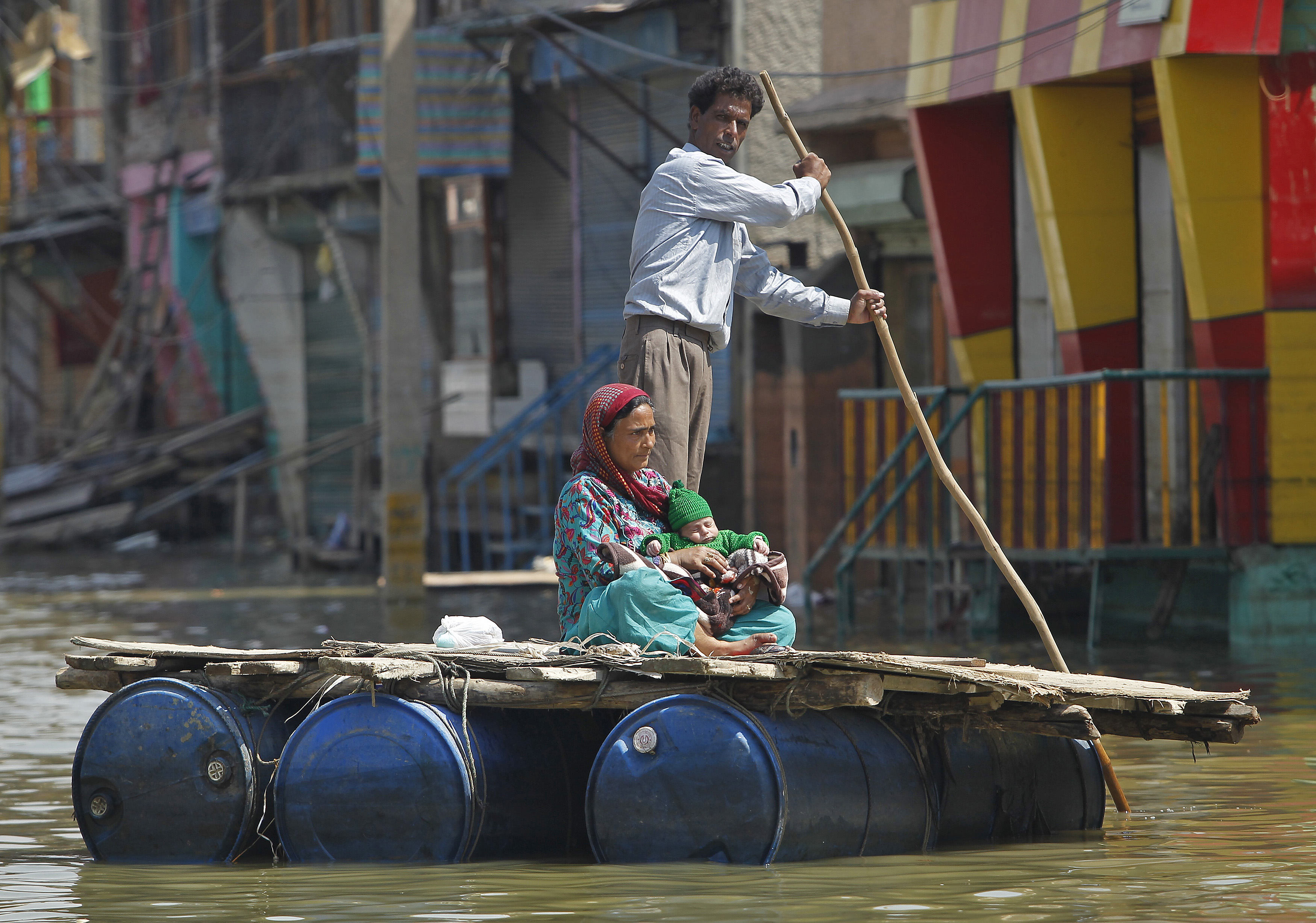 Both the Indian and Pakistani sides of their disputed border have seen extensive flooding that has resulted in hundreds of deaths [Danish Ismail/Reuters]