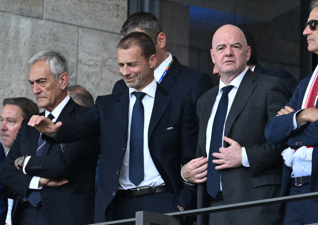 President of the Italian Football Federation Gabriele Gravina, UEFA president Aleksander Ceferin and FIFA president Gianni Infantino are pictured in the stands before the match