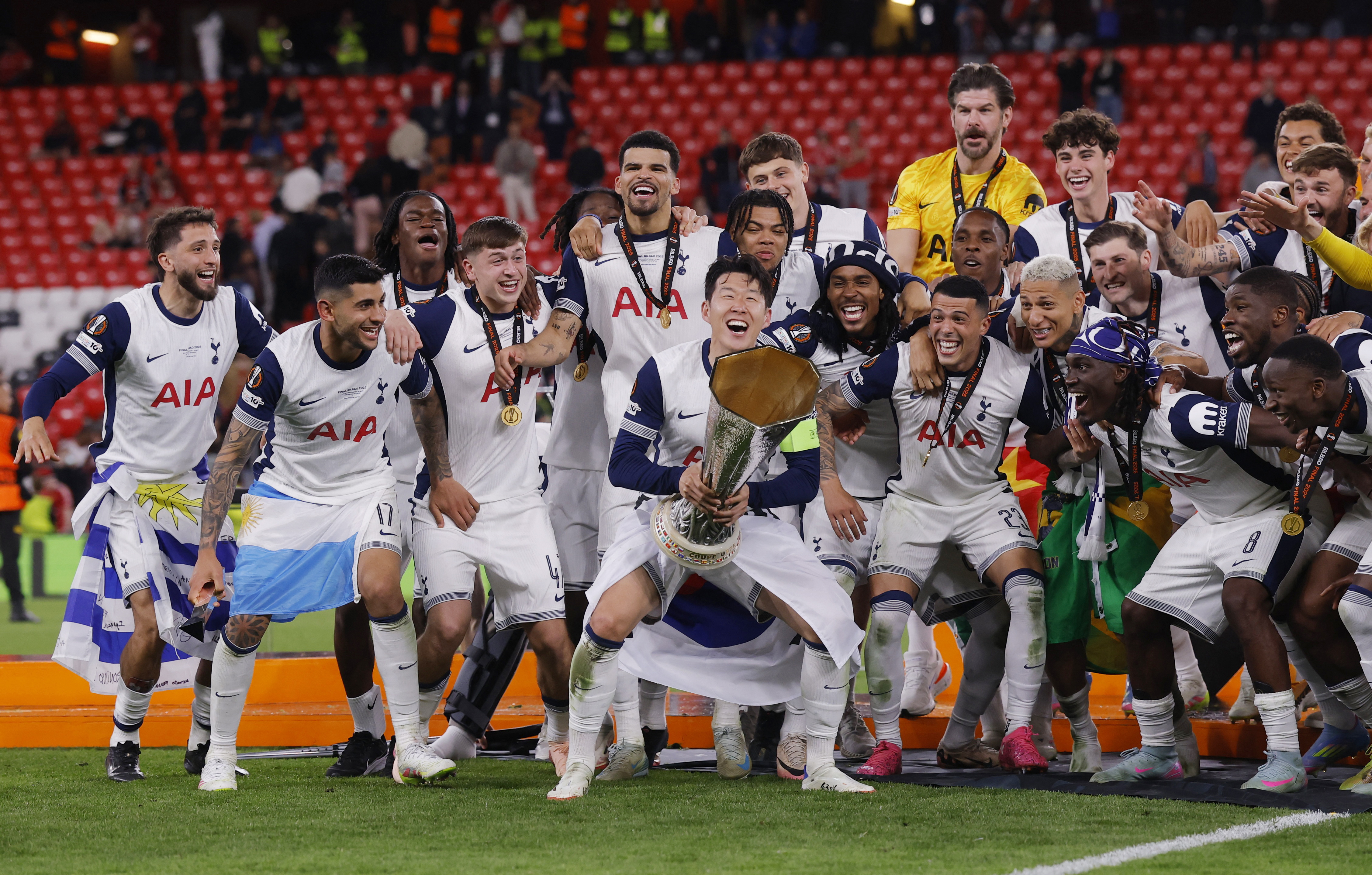 Tottenham Hotspur's Son Heung-min lifts the trophy with teammates after winning the Europa League Final 