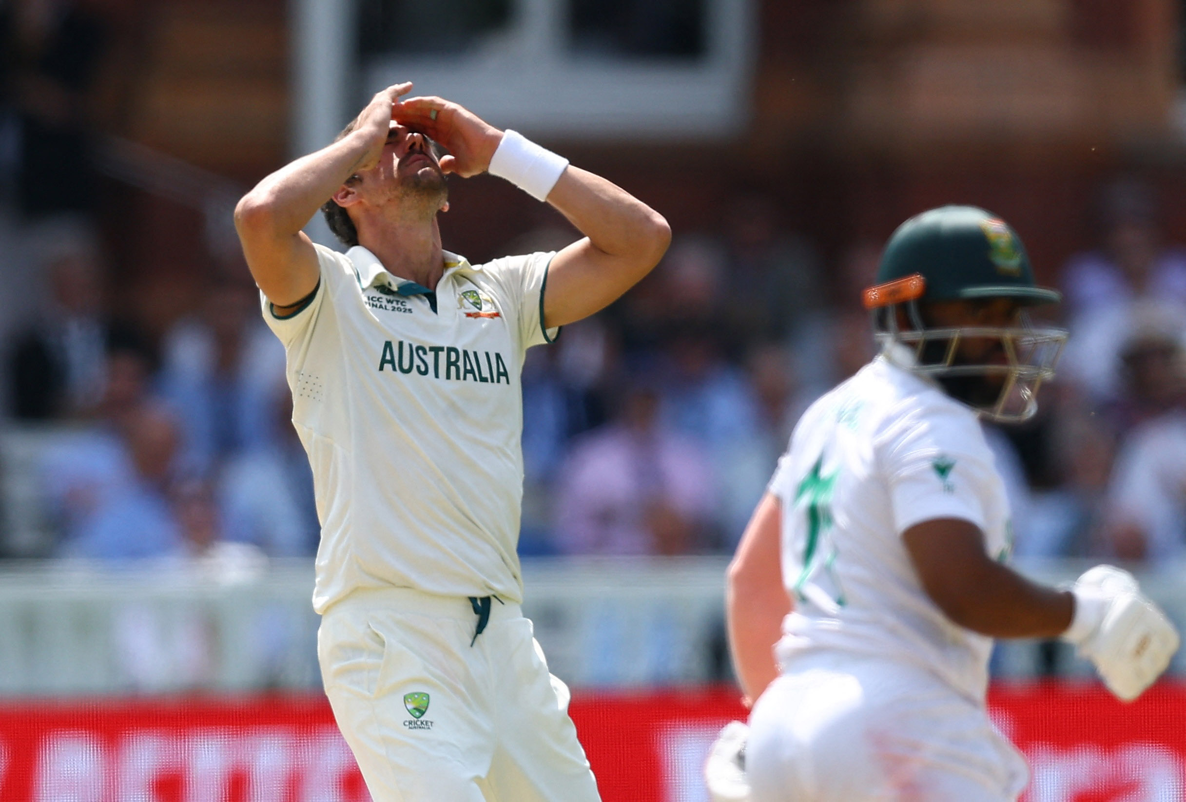 Australia's Mitchell Starc reacts after Steve Smith dropped the catch of South Africa's Temba Bavuma