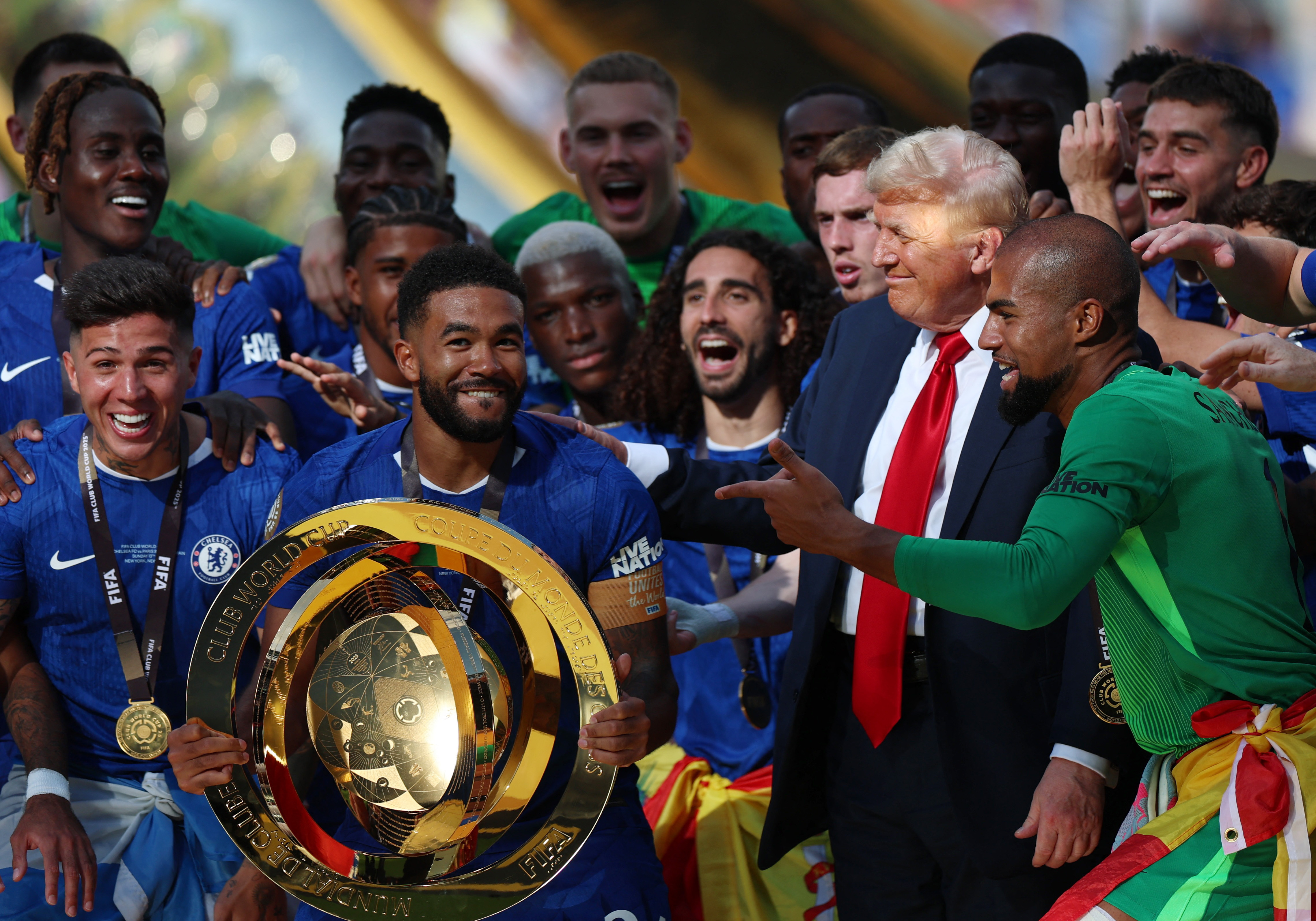 Chelsea's Reece James and teammates celebrate with the trophy alongside U.S. President Donald Trump after winning the FIFA Club World Cup 