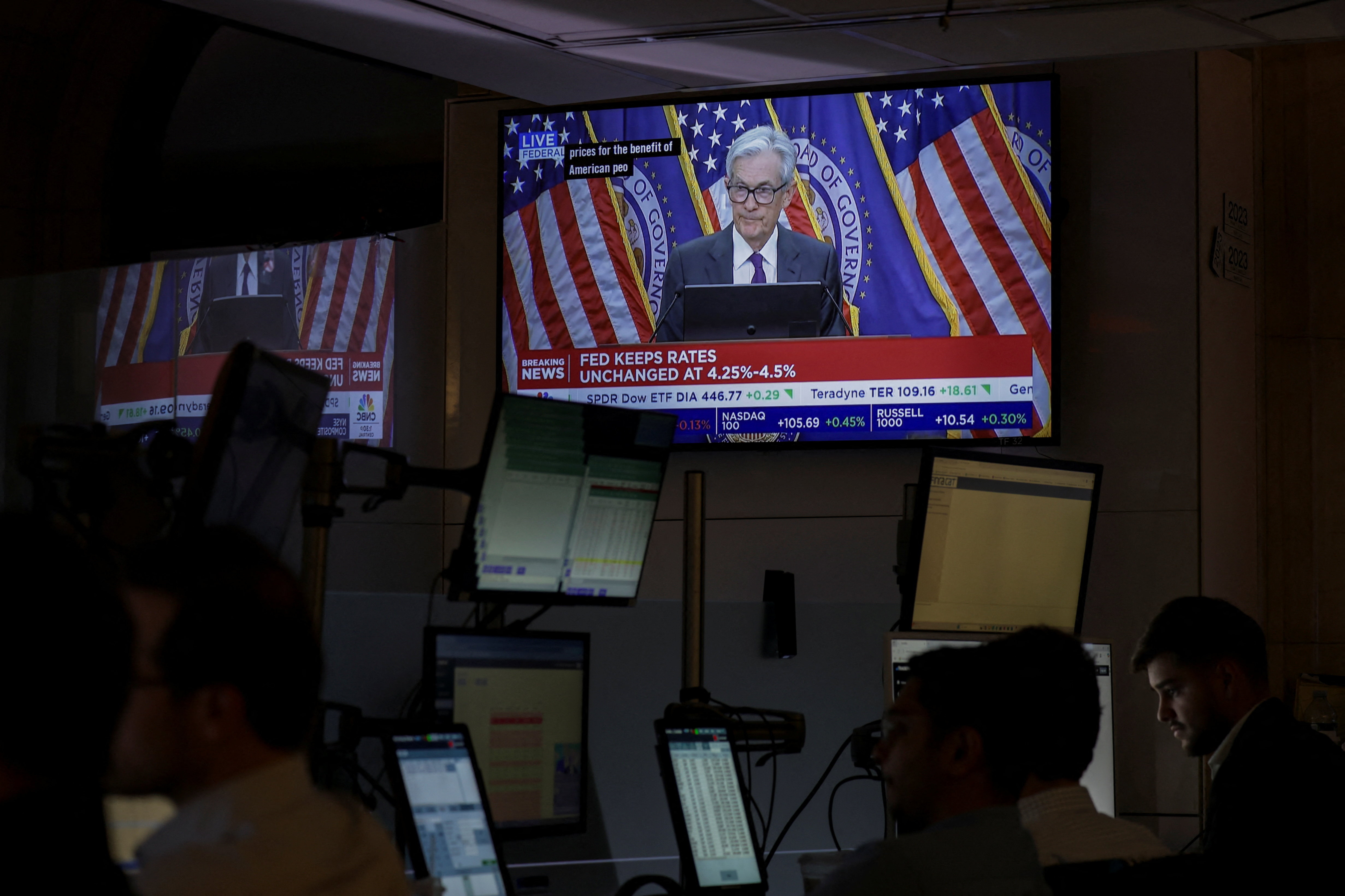 Jerome Powell on a TV screen