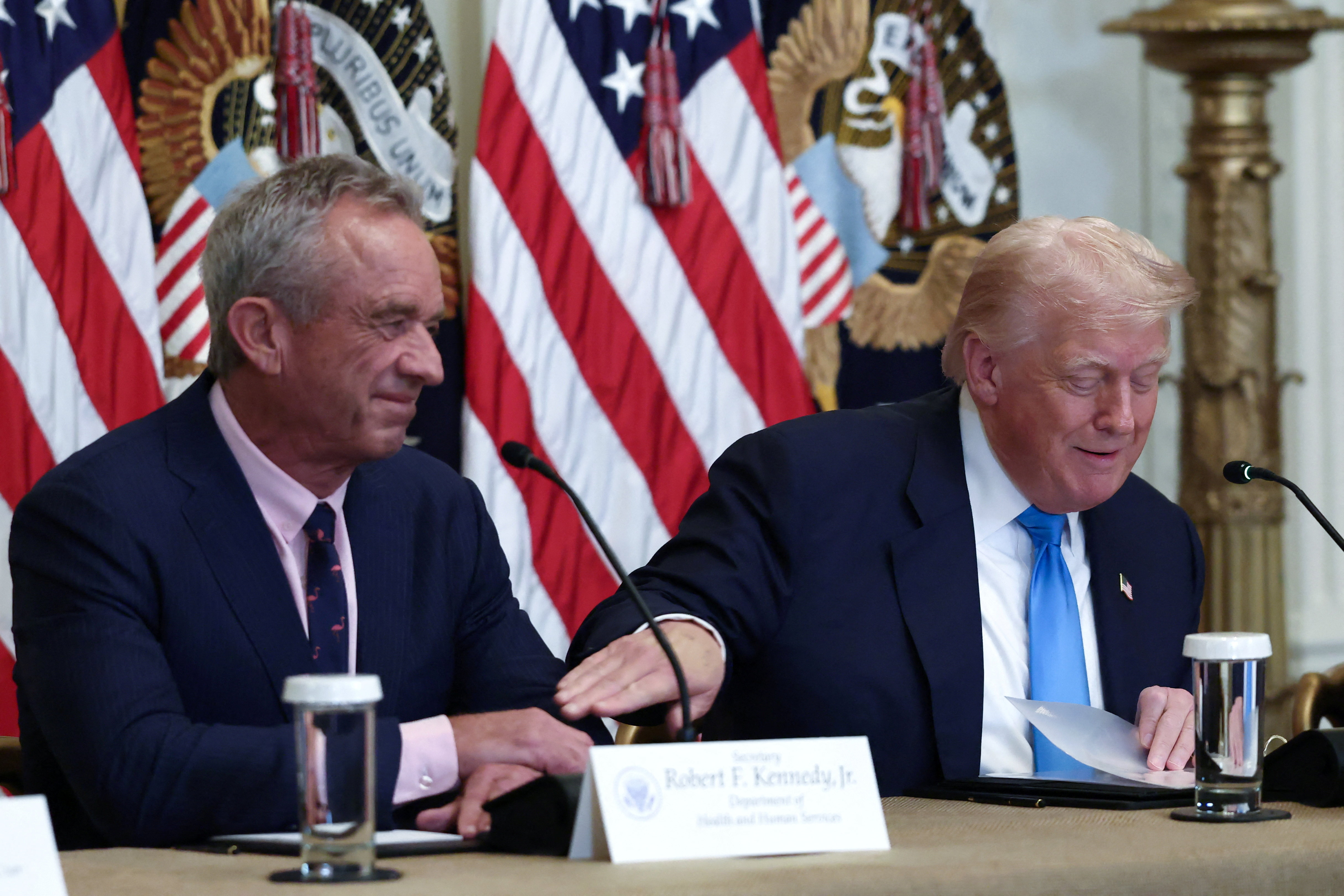 US President Donald Trump interacts with US Health and Human Services Secretary Robert F Kennedy, Jr during the 'Making Health Technology Great Again' event in the East Room at the White House in Washington, DC, US [File: Evelyn Hockstein/Reuters]