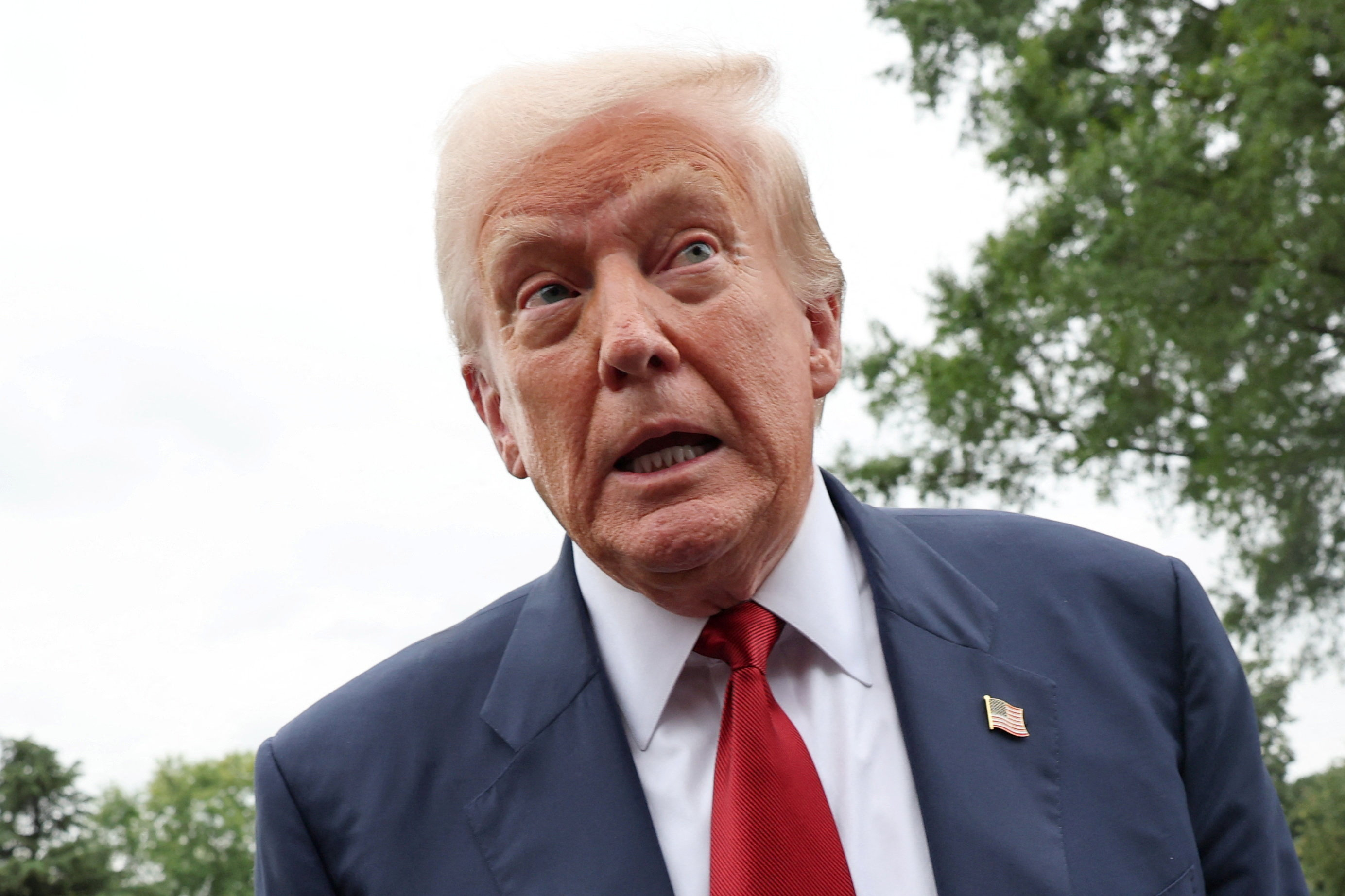 U.S. President Donald Trump speaks to reporters ahed of boarding Marine One to depart for New Jersey, at the White House in Washington, D.C., U.S., August 1, 2025. REUTERS/Jonathan Ernst