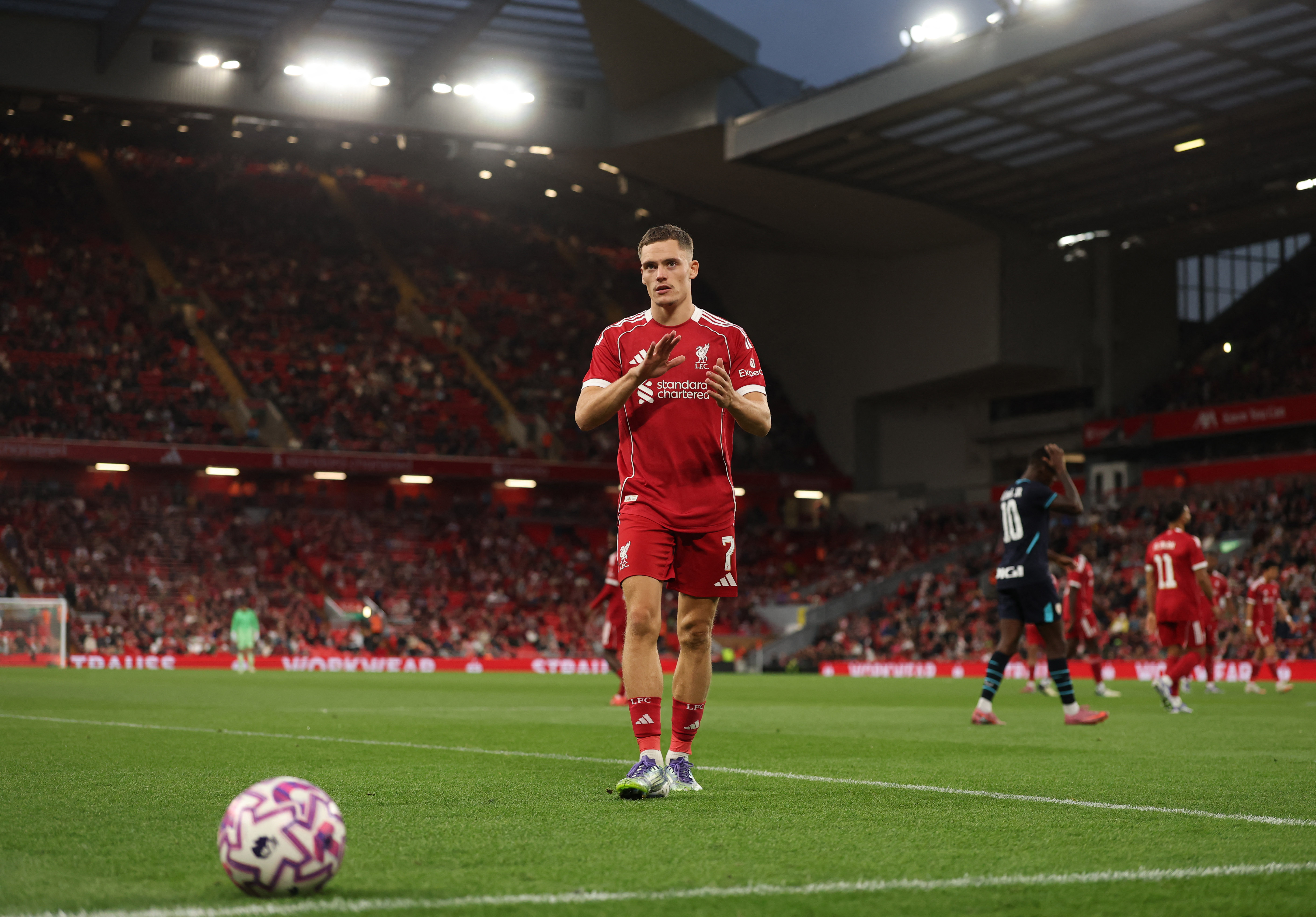 Liverpool's Florian Wirtz applauds fans as he prepares to take a corner kick at Anfield in the pre-season friendly against Athletic Bilbao 