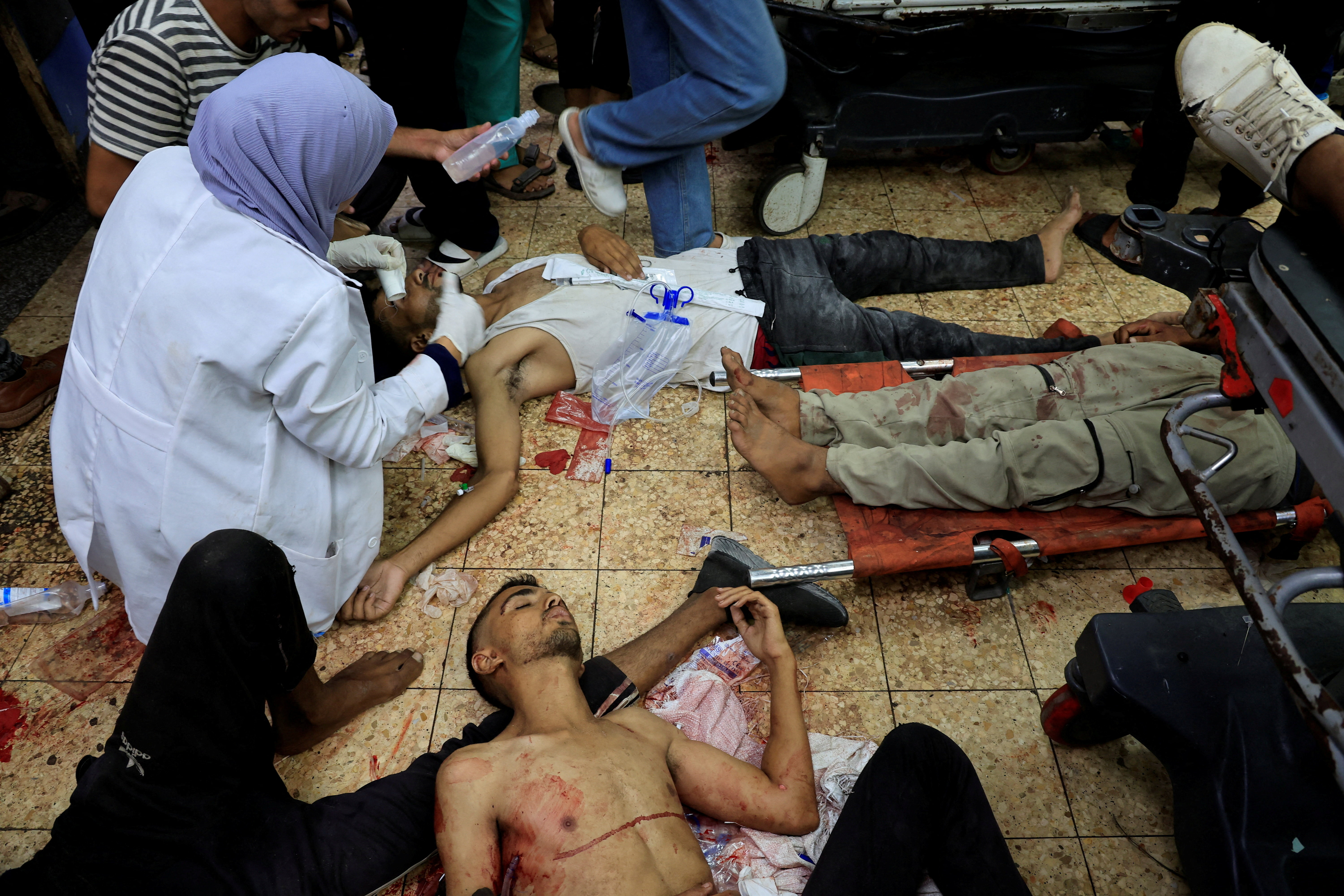 Palestinian casualties of Israeli fire, who were seeking aid, according to medics, are assisted at Nasser Hospital in Khan Younis, southern Gaza Strip, August 5, 2025.