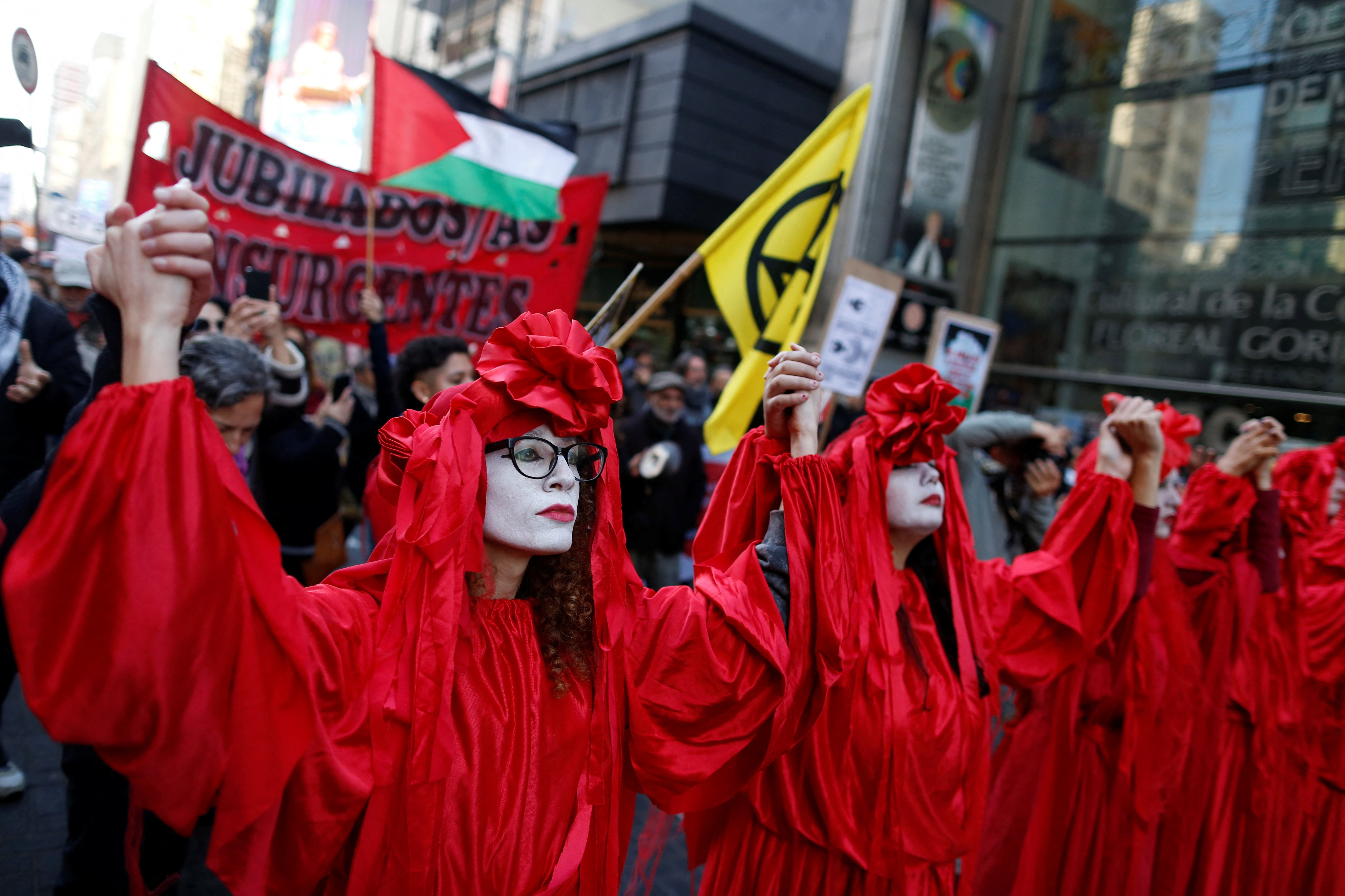 Artists perform during a march in solidarity with the Palestinian people.