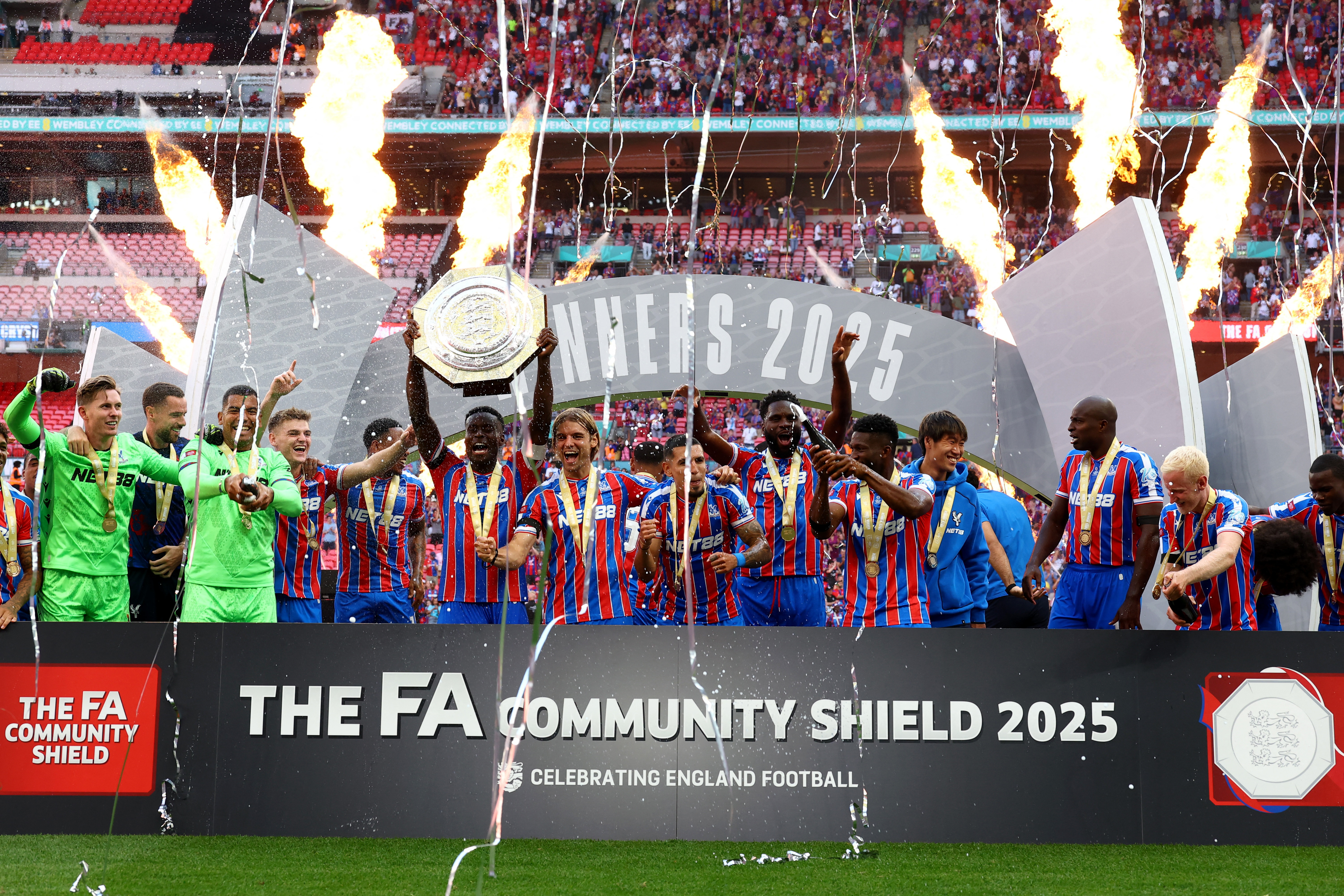 Crystal Palace's Marc Guehi lifts the trophy as he celebrates with teammates after winning the FA Community Shield against Liverpool