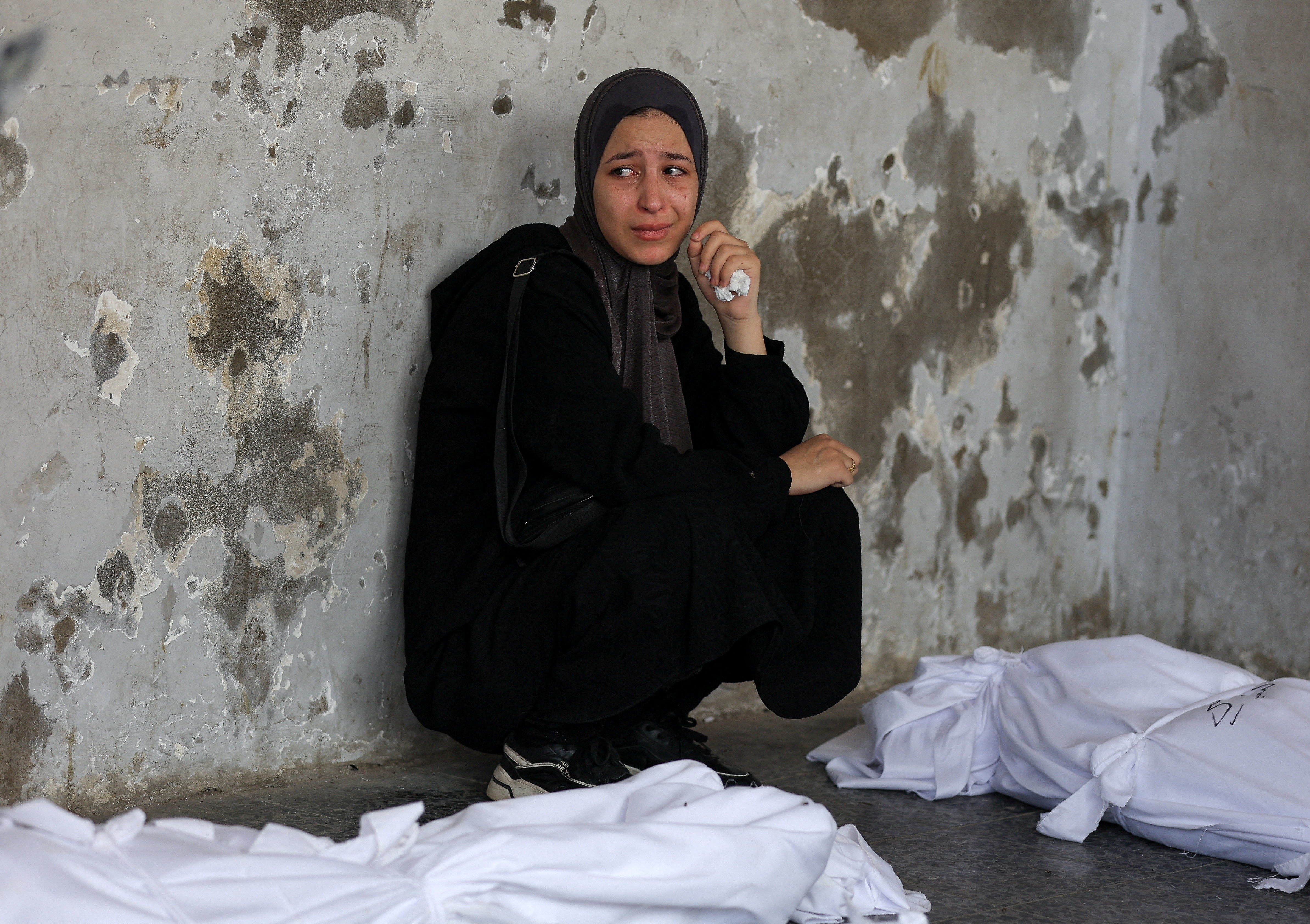 A mourner attends the funeral of Palestinians killed in Israeli strikes, according to medics, at Al-Ahli Arab Hospital in Gaza City August 12, 2025. REUTERS/Dawoud Abu Alkas TPX IMAGES OF THE DAY