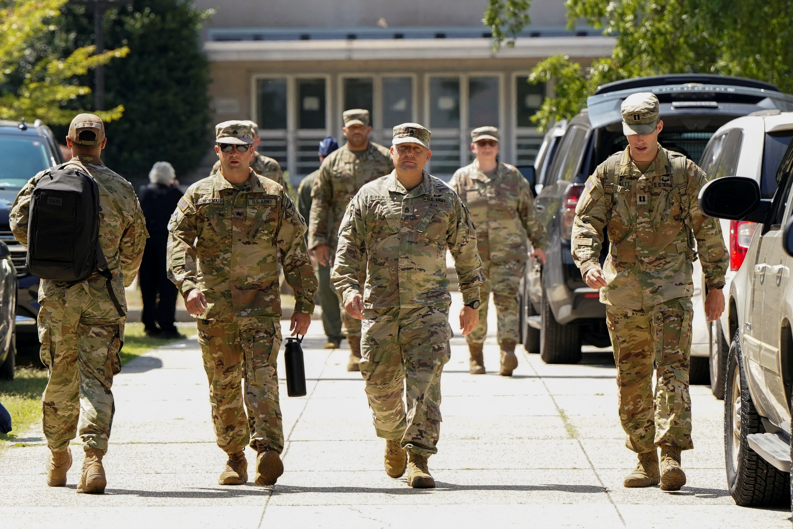 US military personnel walk outside the DC Armory,