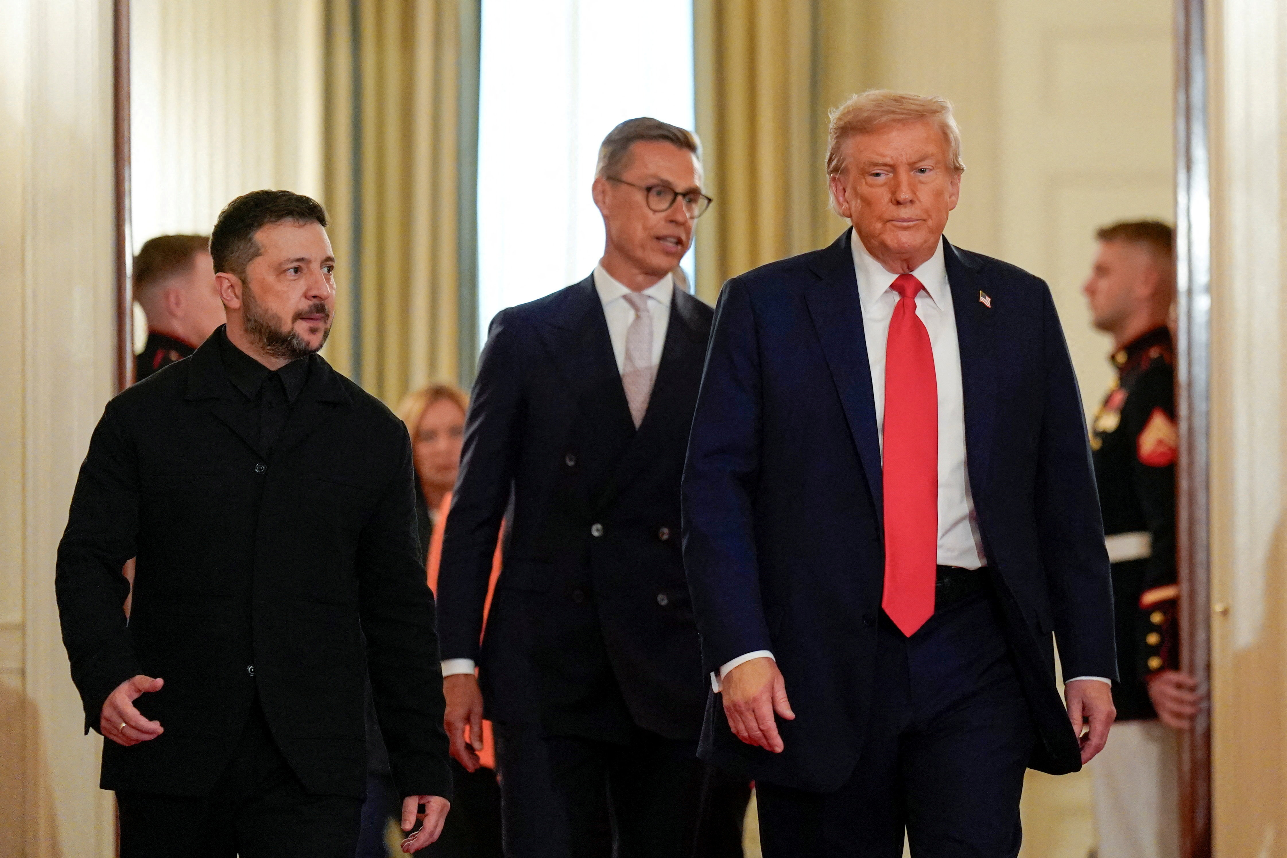 U.S. President Donald Trump and Ukrainian President Volodymyr Zelenskiy walk during a meeting, amid negotiations to end the Russian war in Ukraine