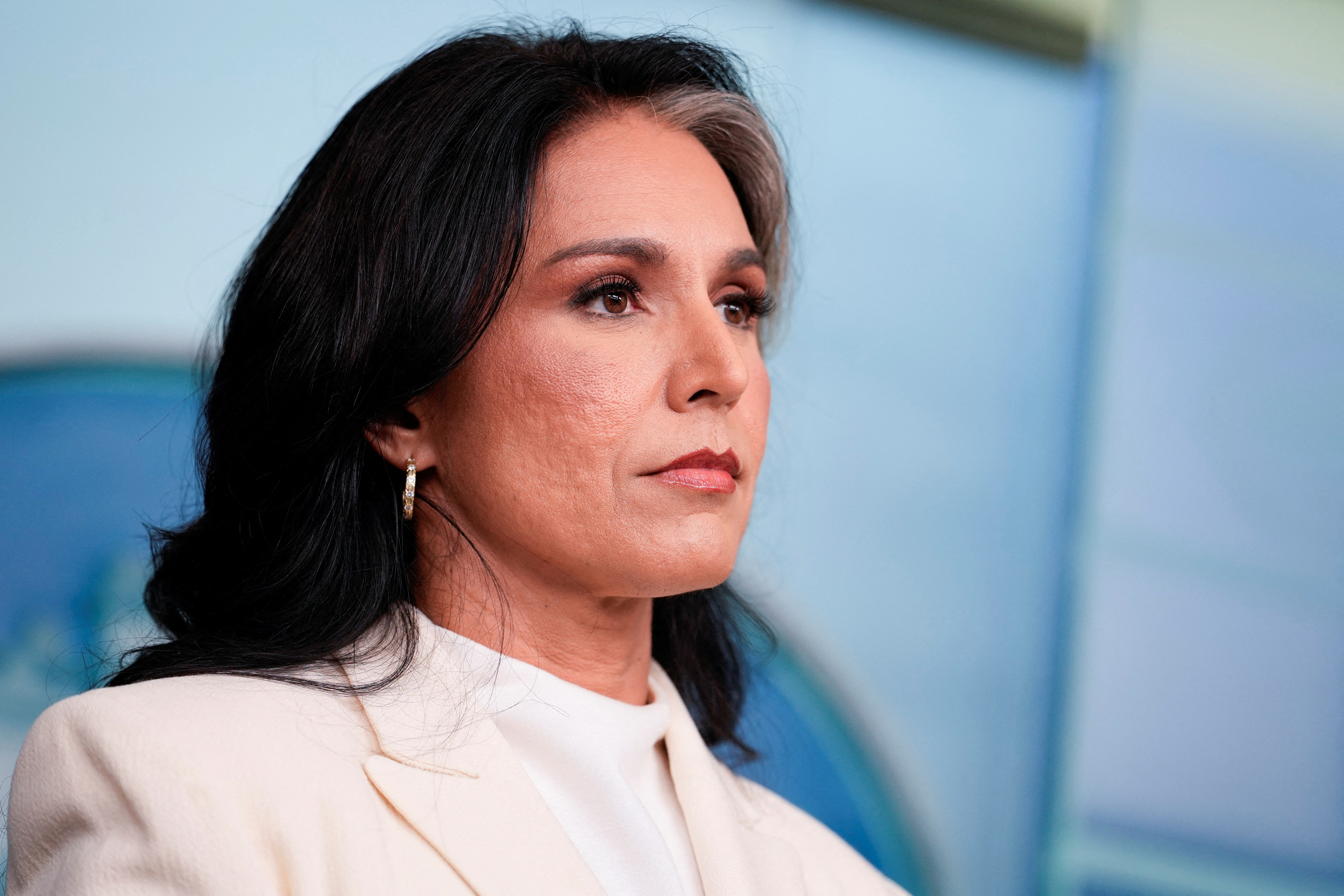 Director of National Intelligence Tulsi Gabbard looks on during a press briefing, at the White House in Washington, DC, in July. [File: Kent Nishimura]